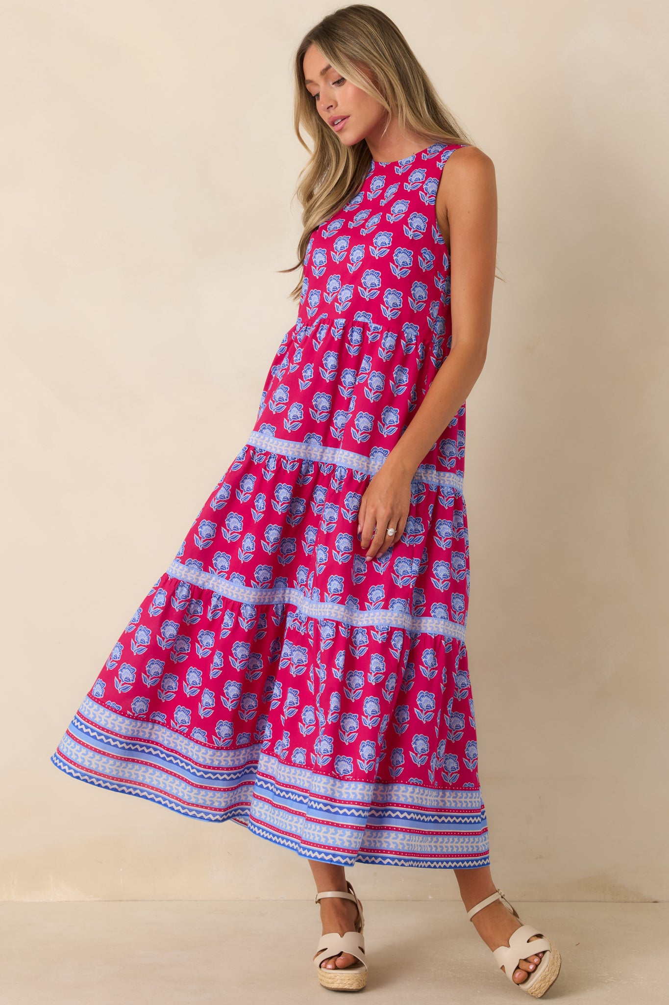 Cotton midi dress with a vibrant floral pattern, smooth lining, and an effortless flowing design.