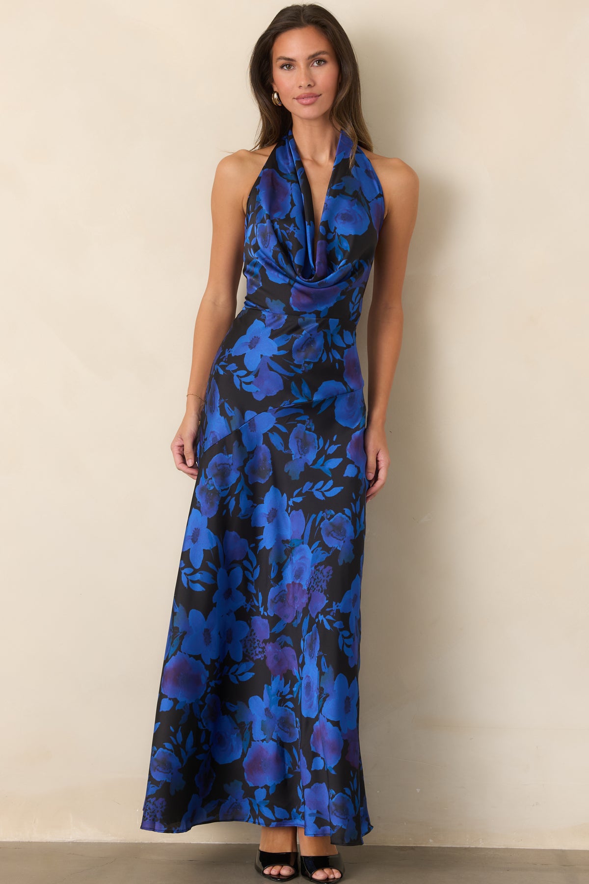Floral satin halter maxi dress featuring a defined waist, draped cowl neckline, and flowing skirt.