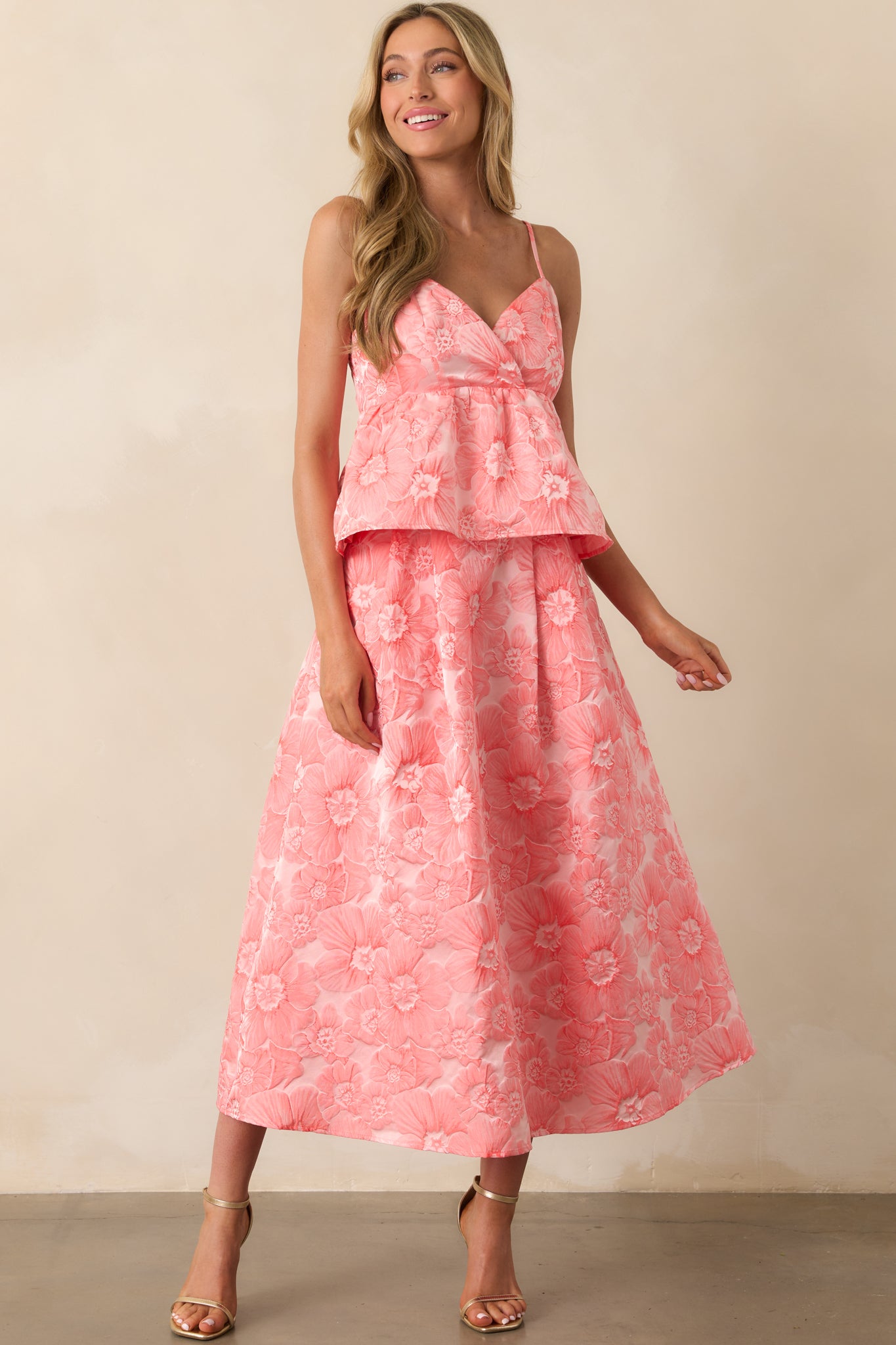 Floral skirt featuring a structured waistband and gently flared silhouette in a vibrant pink coral hue.