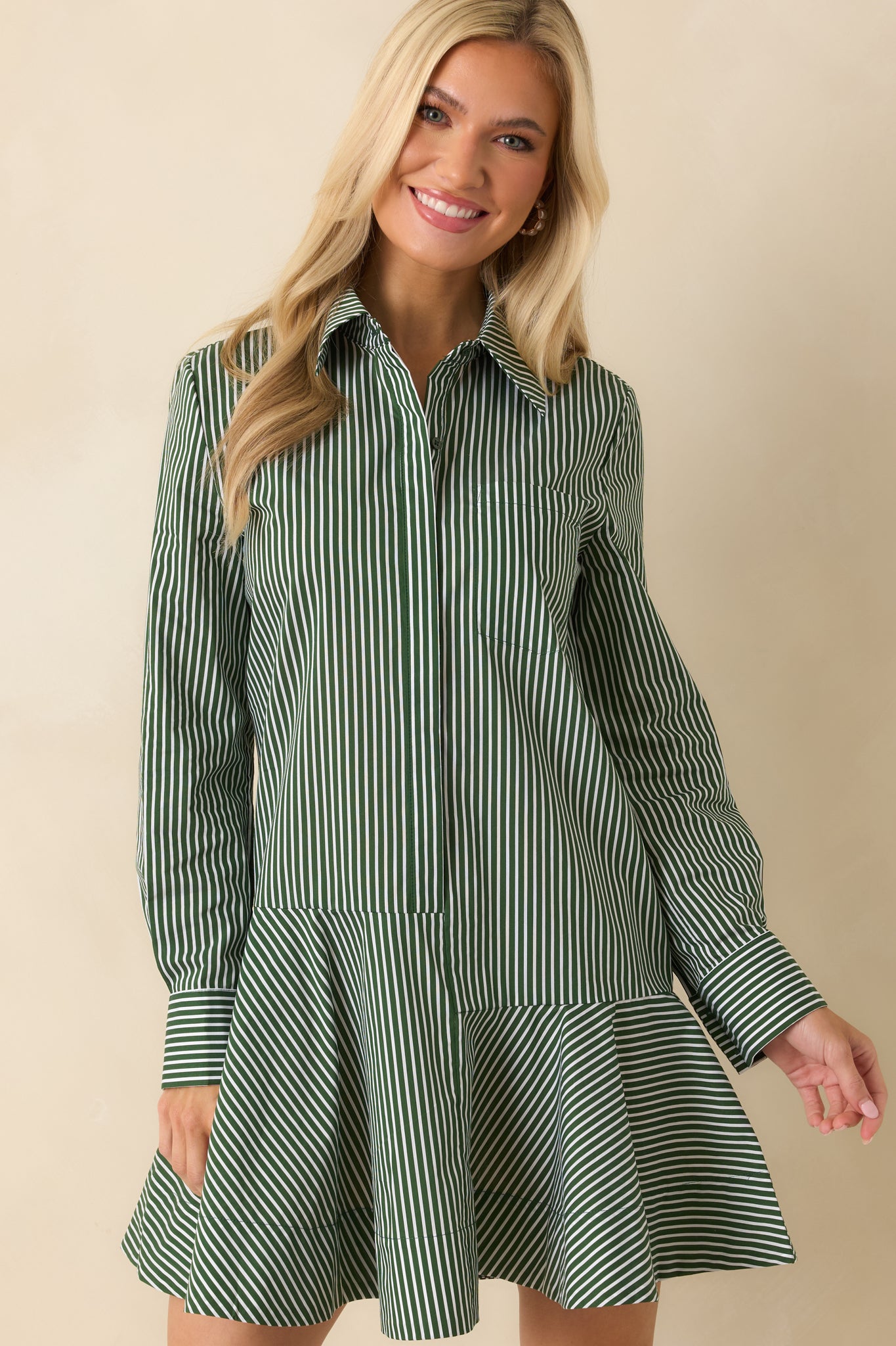 Flounced skirt portion emphasizing the A-line shape and fluid drape of the fabric.