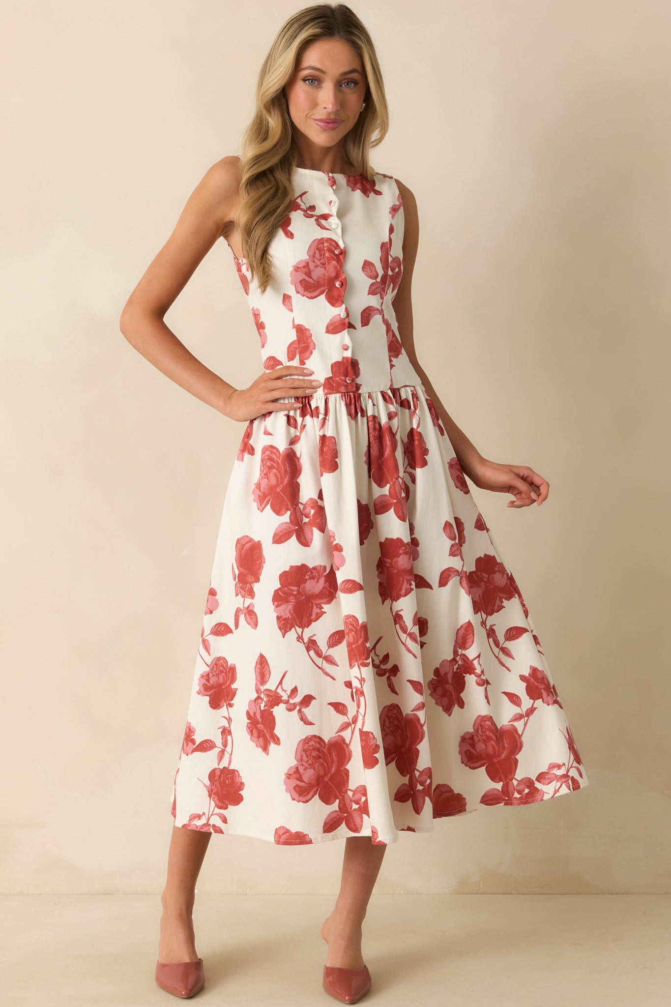 Flowing ivory dress featuring a faux button front bodice with scallop trim placket.