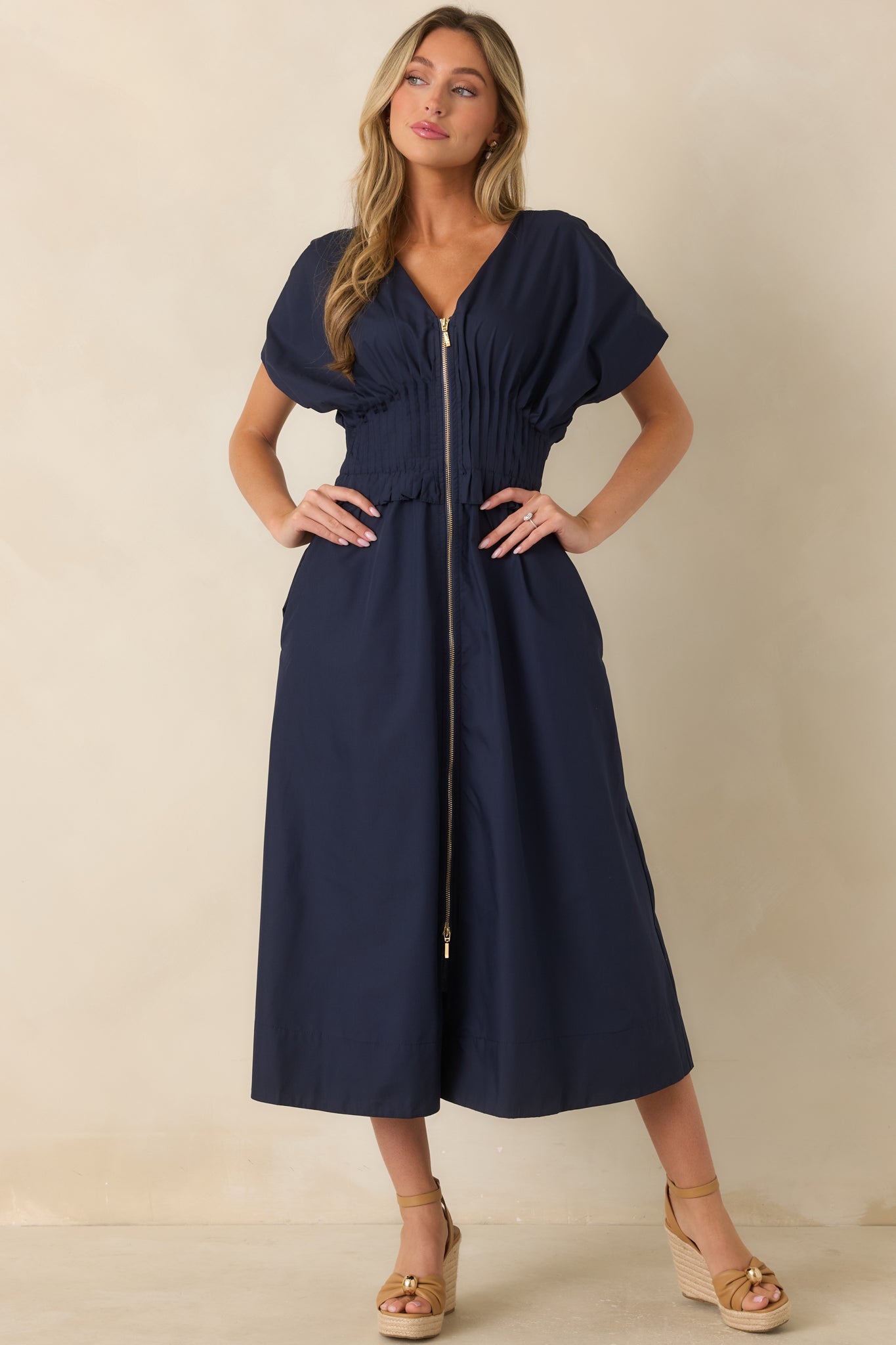 Flowing navy maxi dress featuring a ruffled waistband, relaxed skirt, and comfortable silhouette.