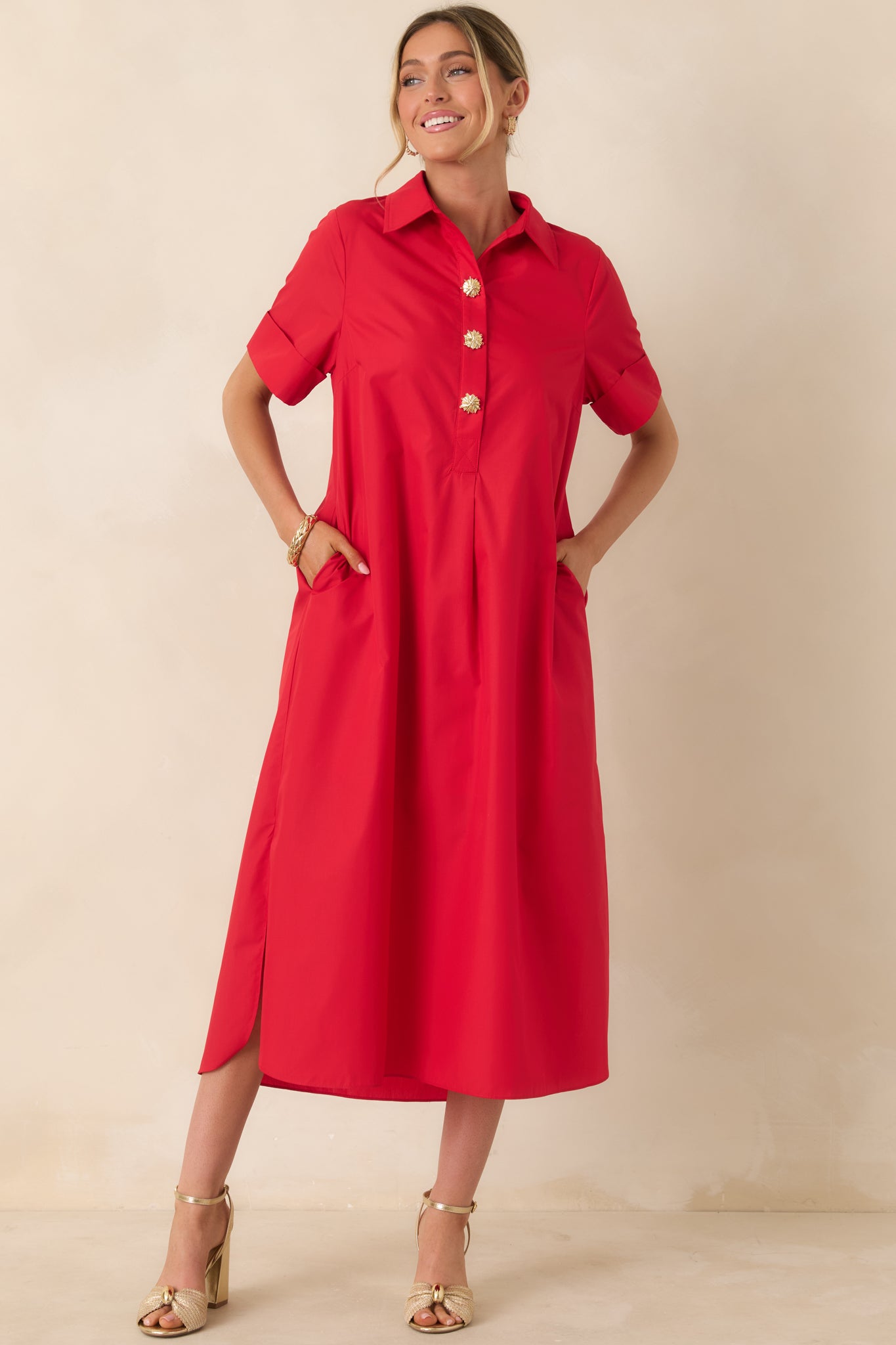 Flowing red maxi dress featuring functional side pockets and structured collar.