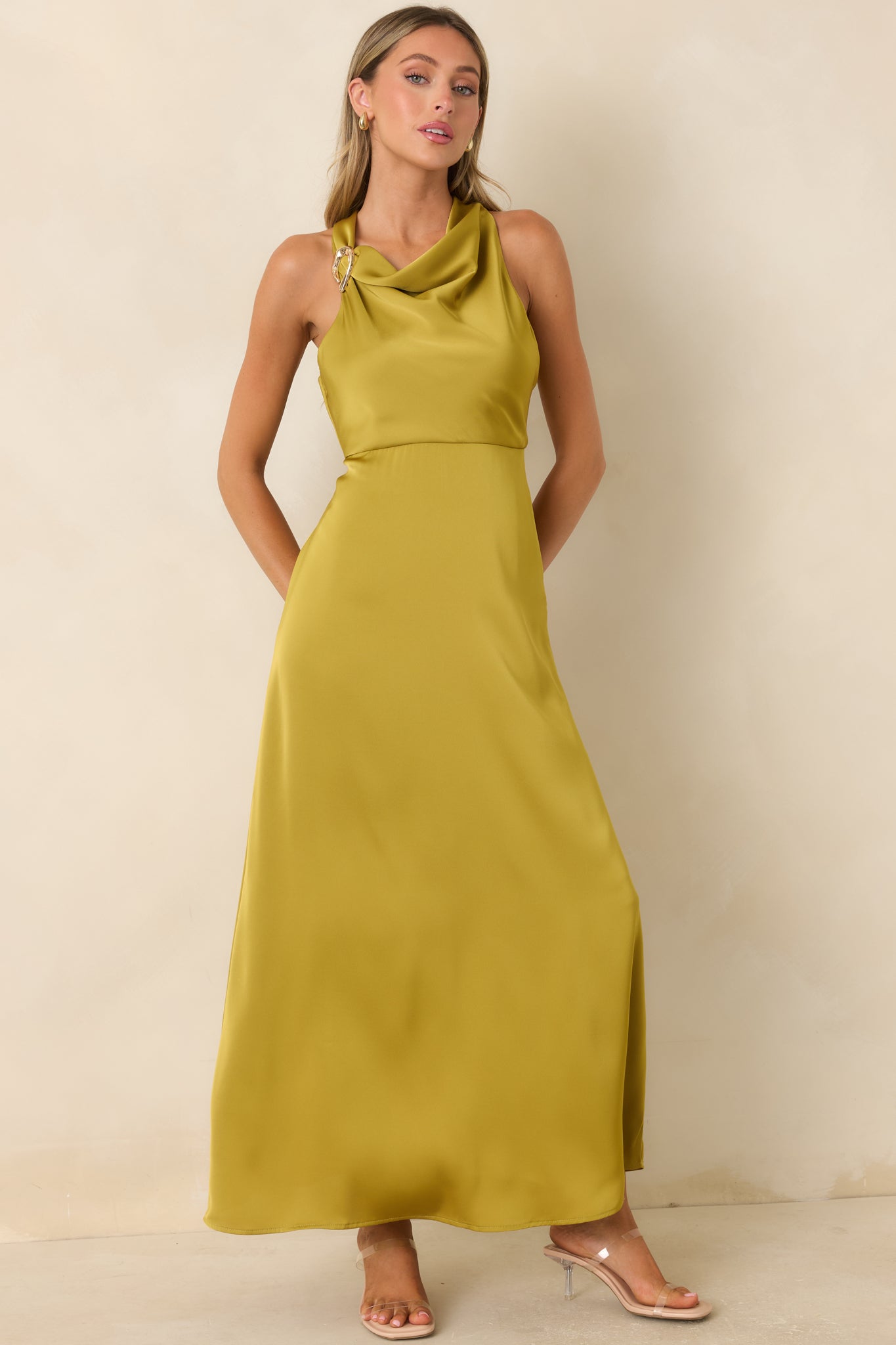 Flowing satin maxi dress featuring a bold shoulder accent, concealed zipper, and timeless elegant design.