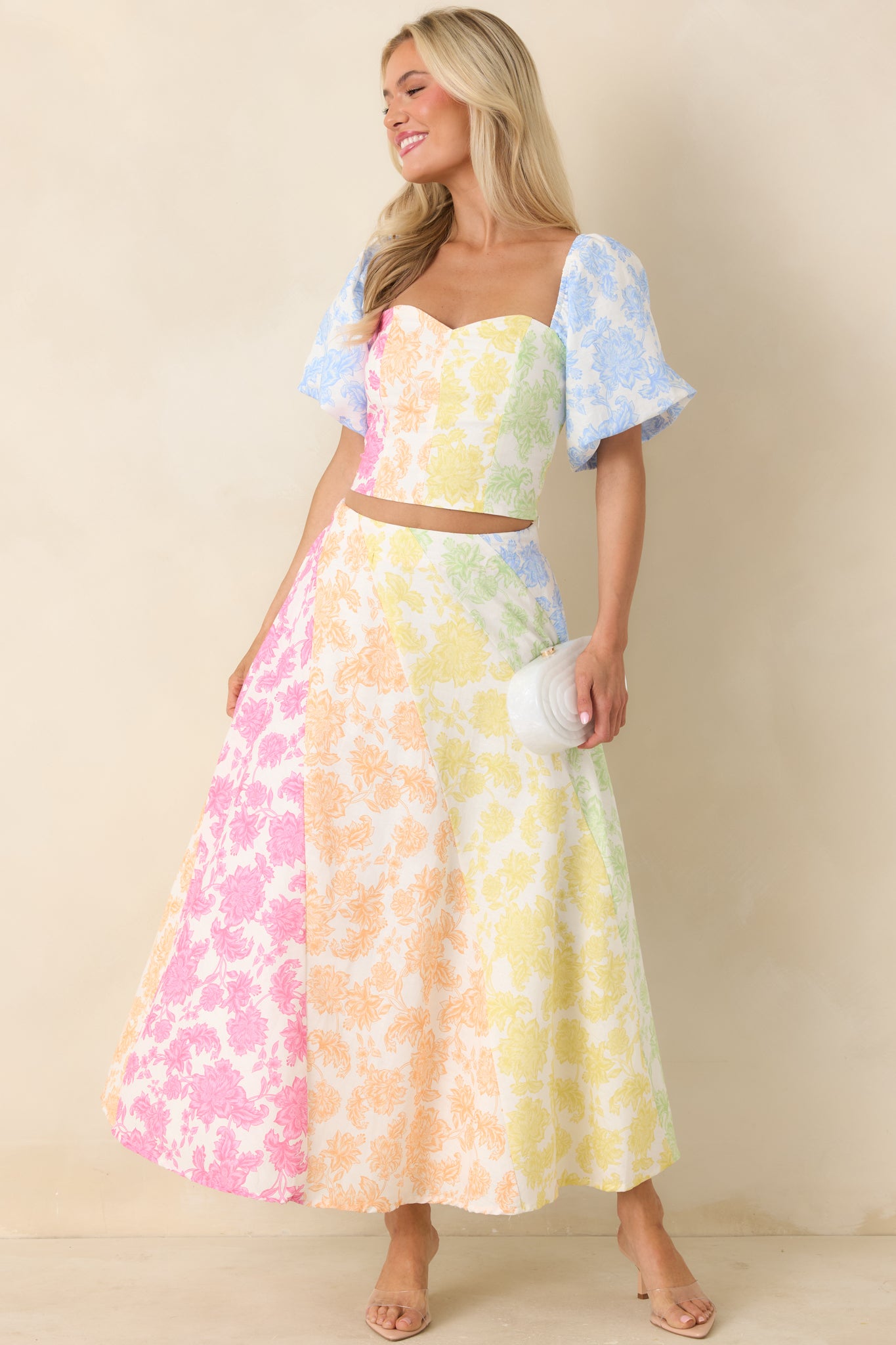 Flowing skirt featuring softly blended floral panels, sweeping midi length, and flattering waistline.