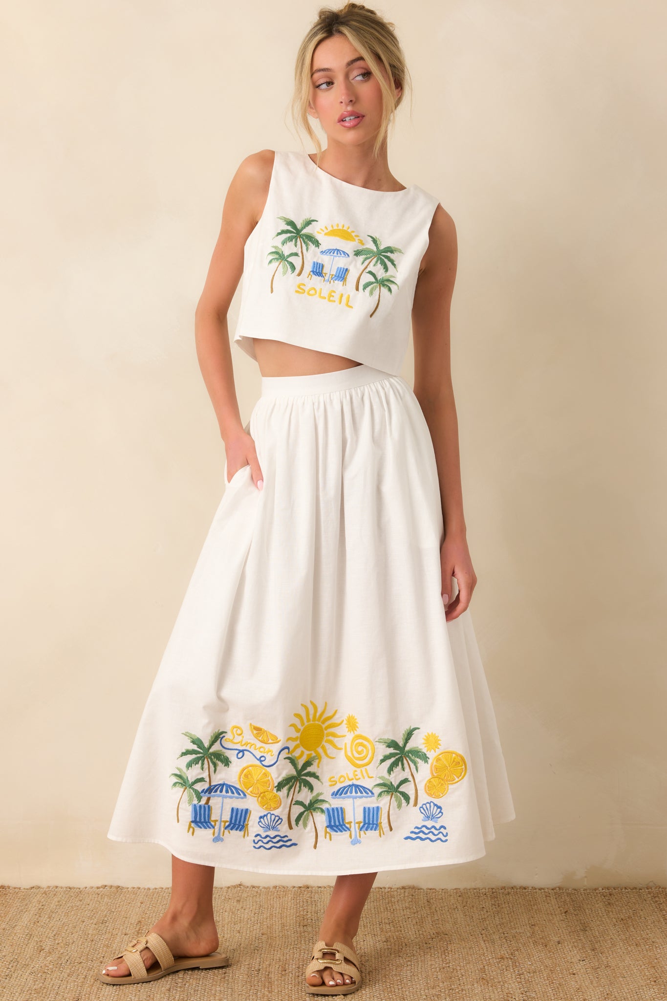 Flowing white skirt highlighting a breezy silhouette with detailed coastal-inspired embroidery and a comfortable, flexible waistband.