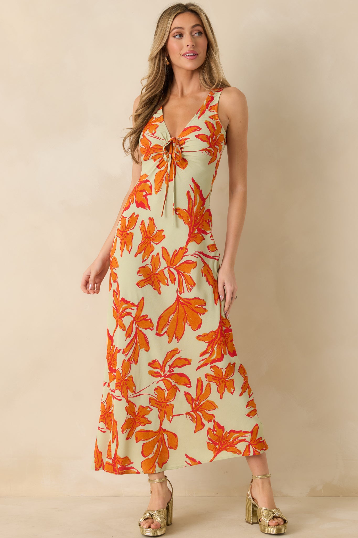 Flowy floral print maxi dress featuring a sleeveless shape and smooth silhouette.