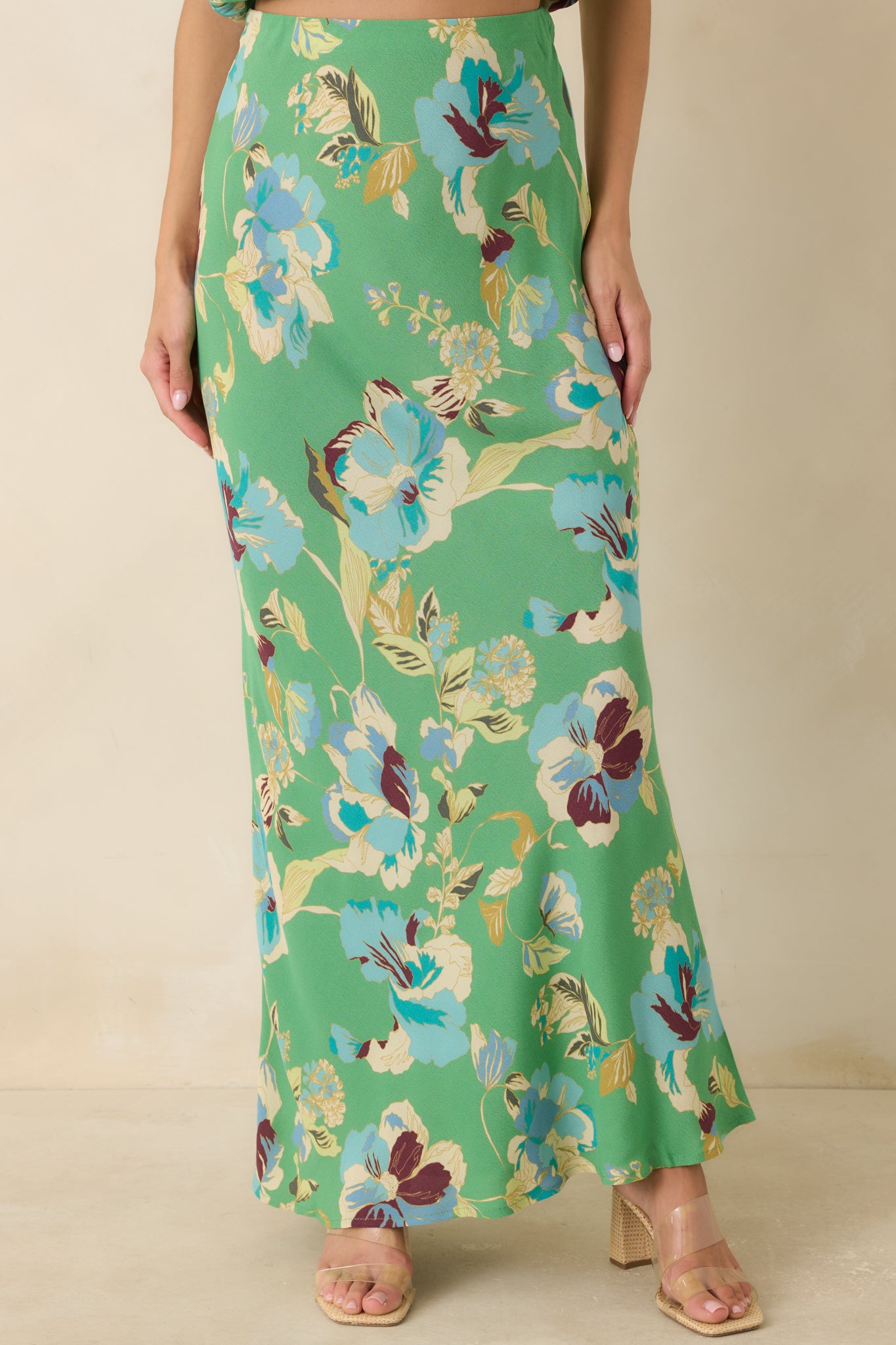 Fluid lightweight fabric highlights the flattering bias-cut shape and elegant movement of this maxi skirt.