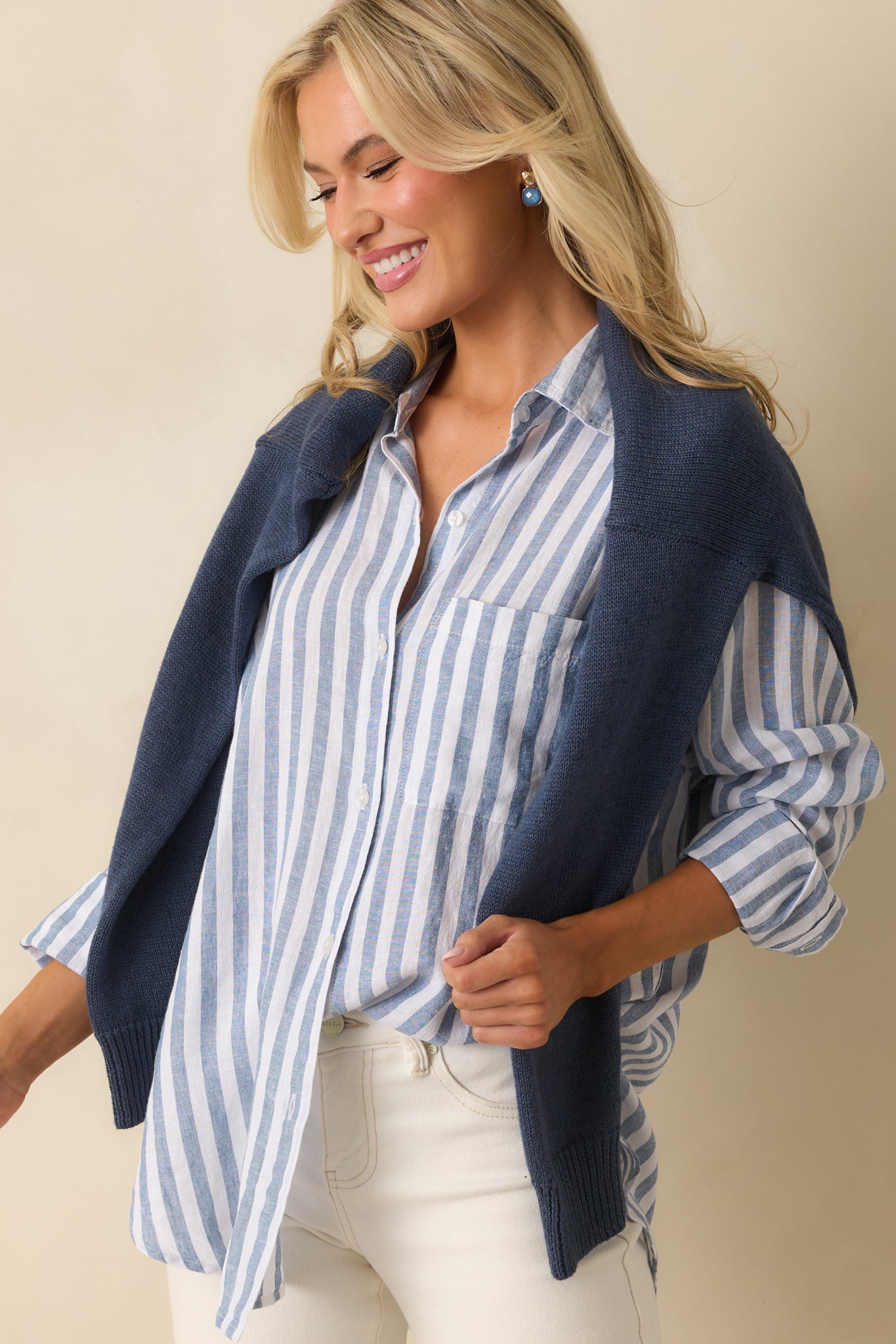 Focus on the button-up front and stripes, highlighting the smooth linen blend texture.