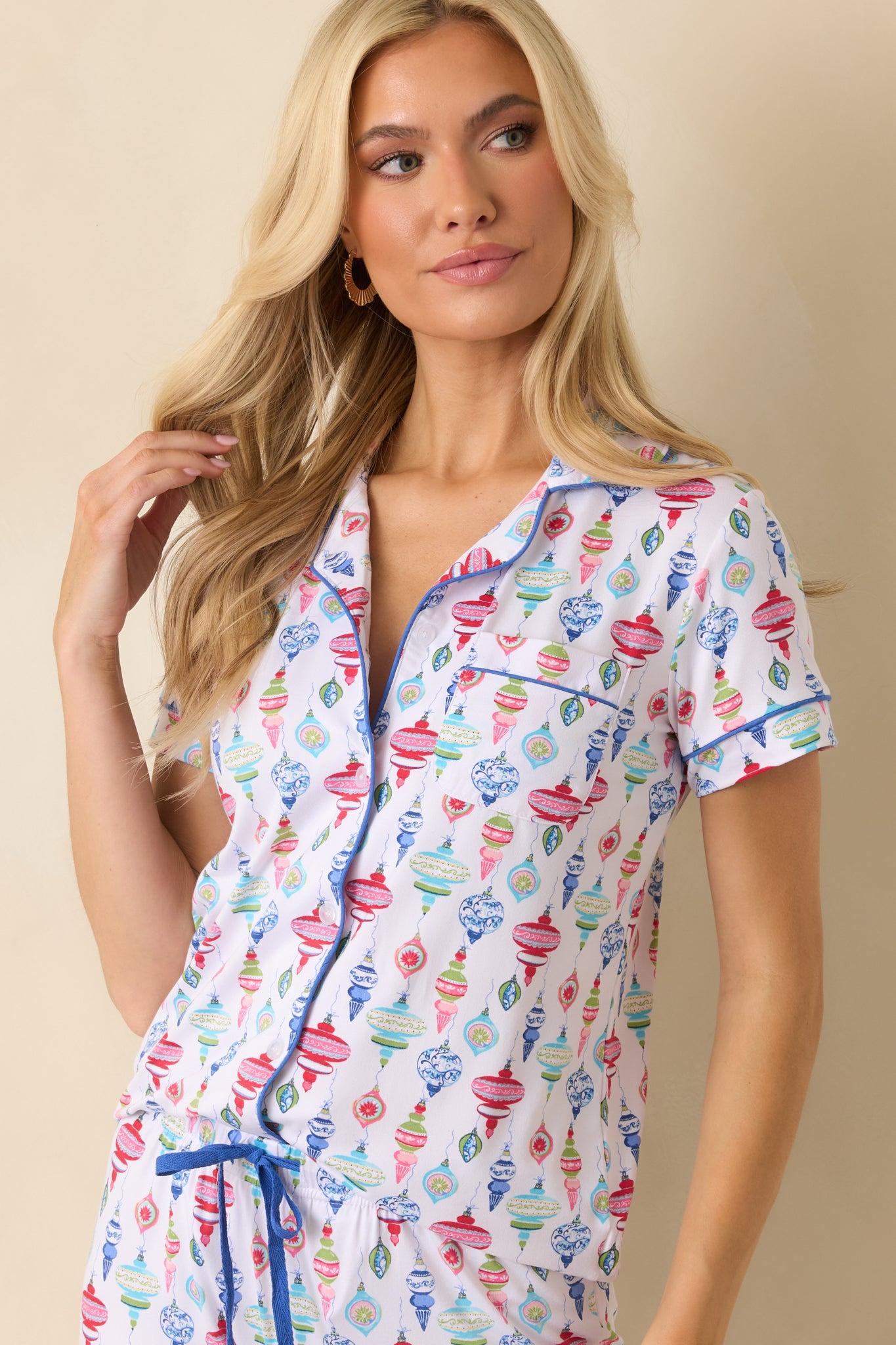 A focused look at the bright ornaments and smooth fabric texture near the neckline.