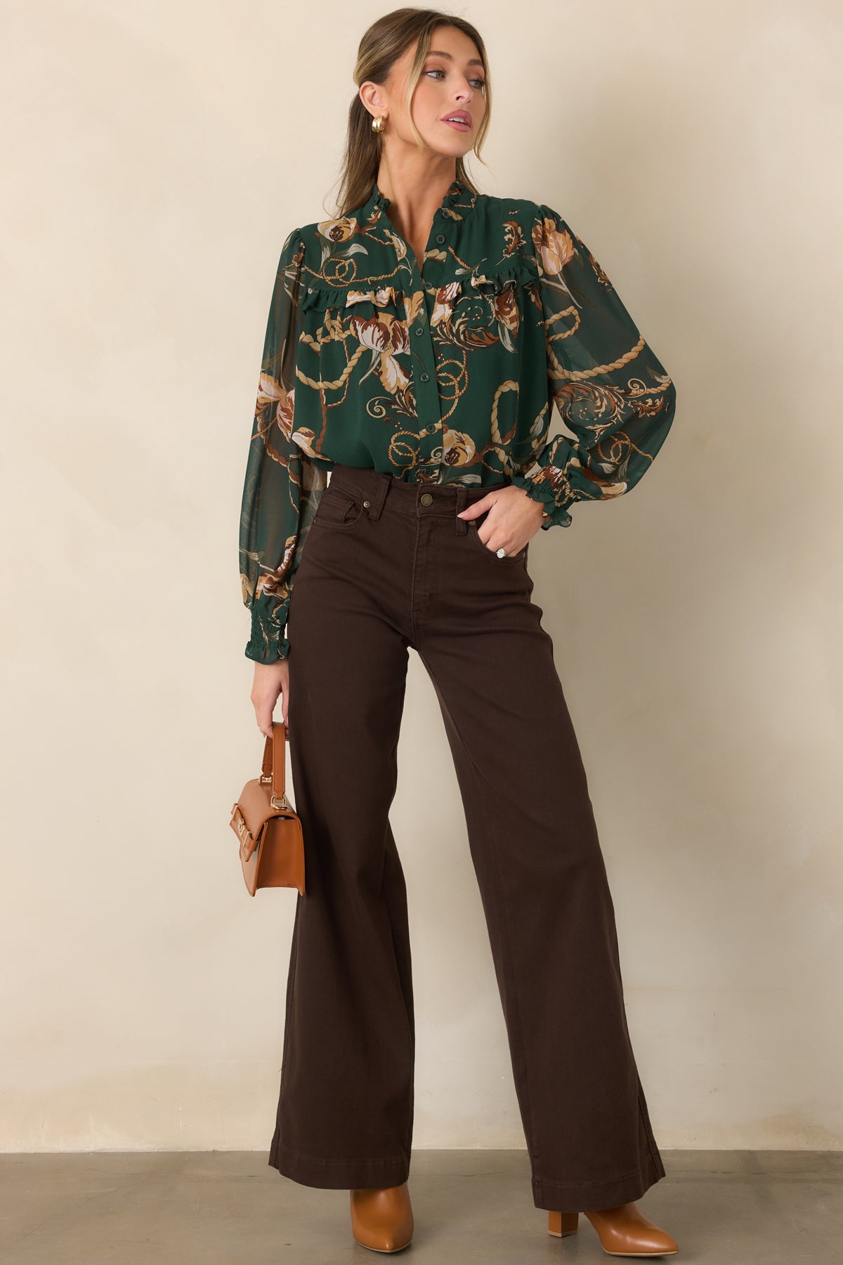 Forest green blouse showcasing the functional button-down front, ruffle-trimmed yoke, and softly gathered relaxed shape.