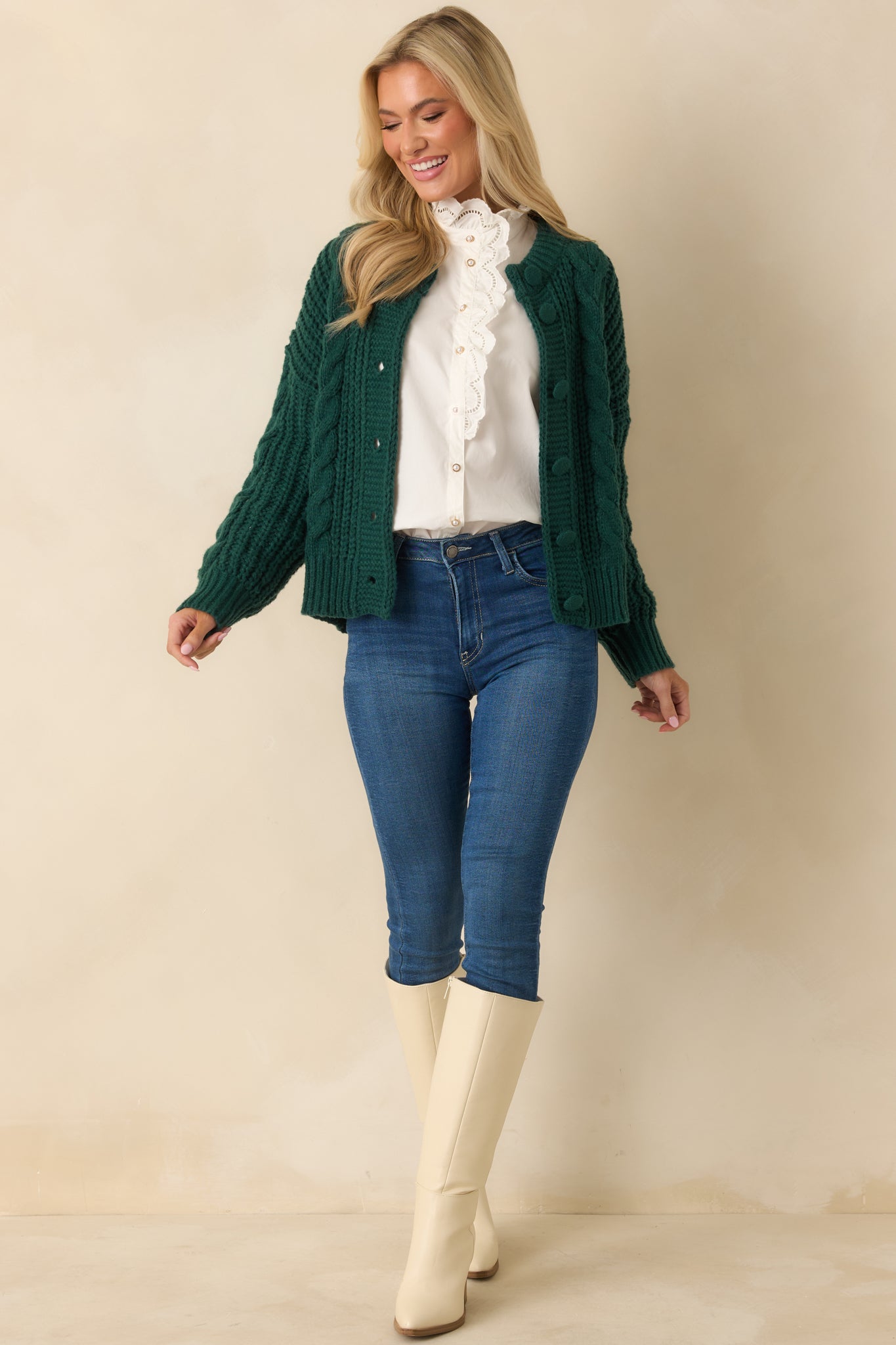 Full body front view of cardigan with functional button front and covered knit buttons.