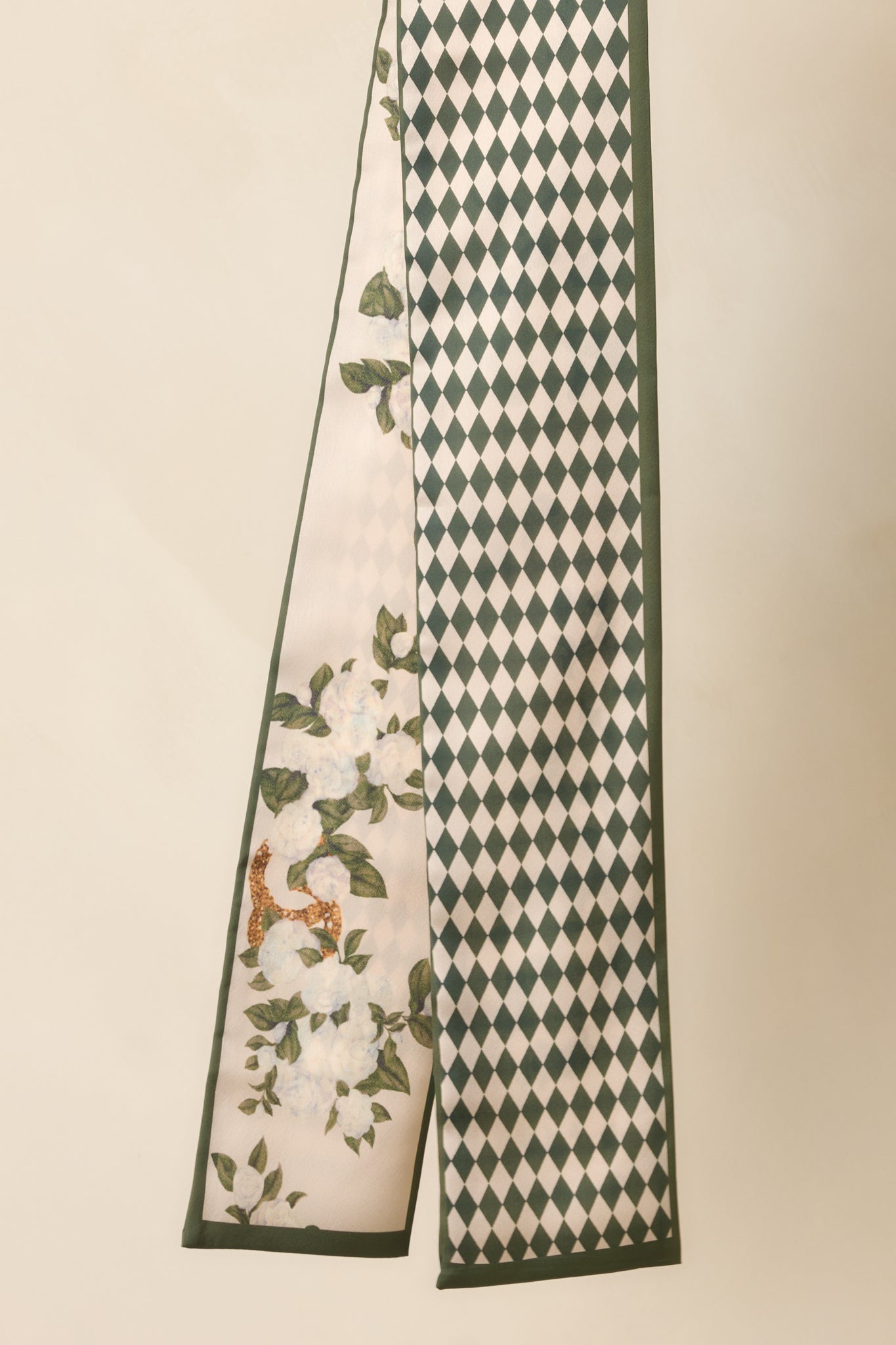 Close view of the forest green reverse side highlighting the classic diamond pattern and silky texture.