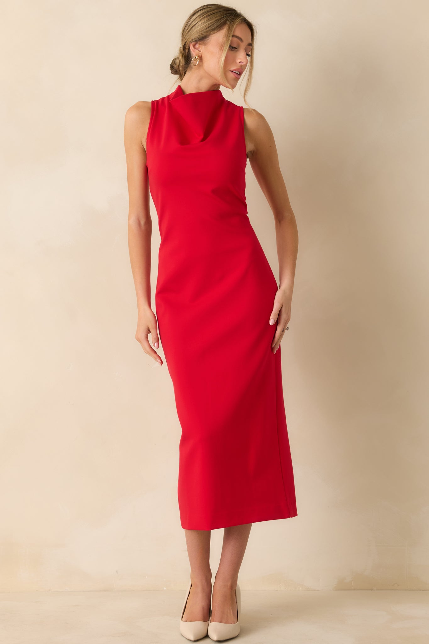 Form-fitting red midi dress featuring a high neckline and figure-flattering design, crafted from smooth, flexible ponte fabric.