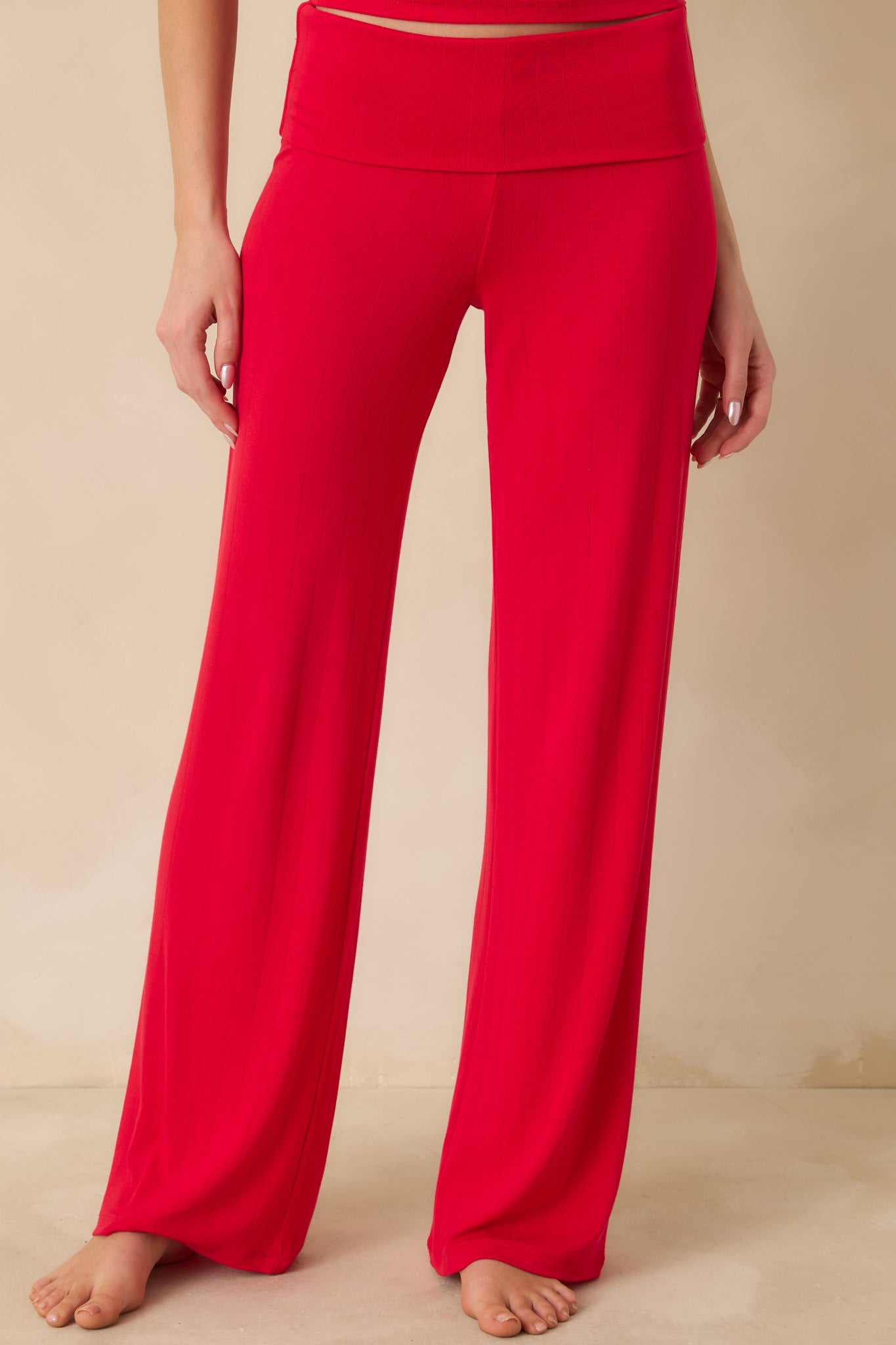 Close framing highlighting the smooth stretch fabric and customizable waistband