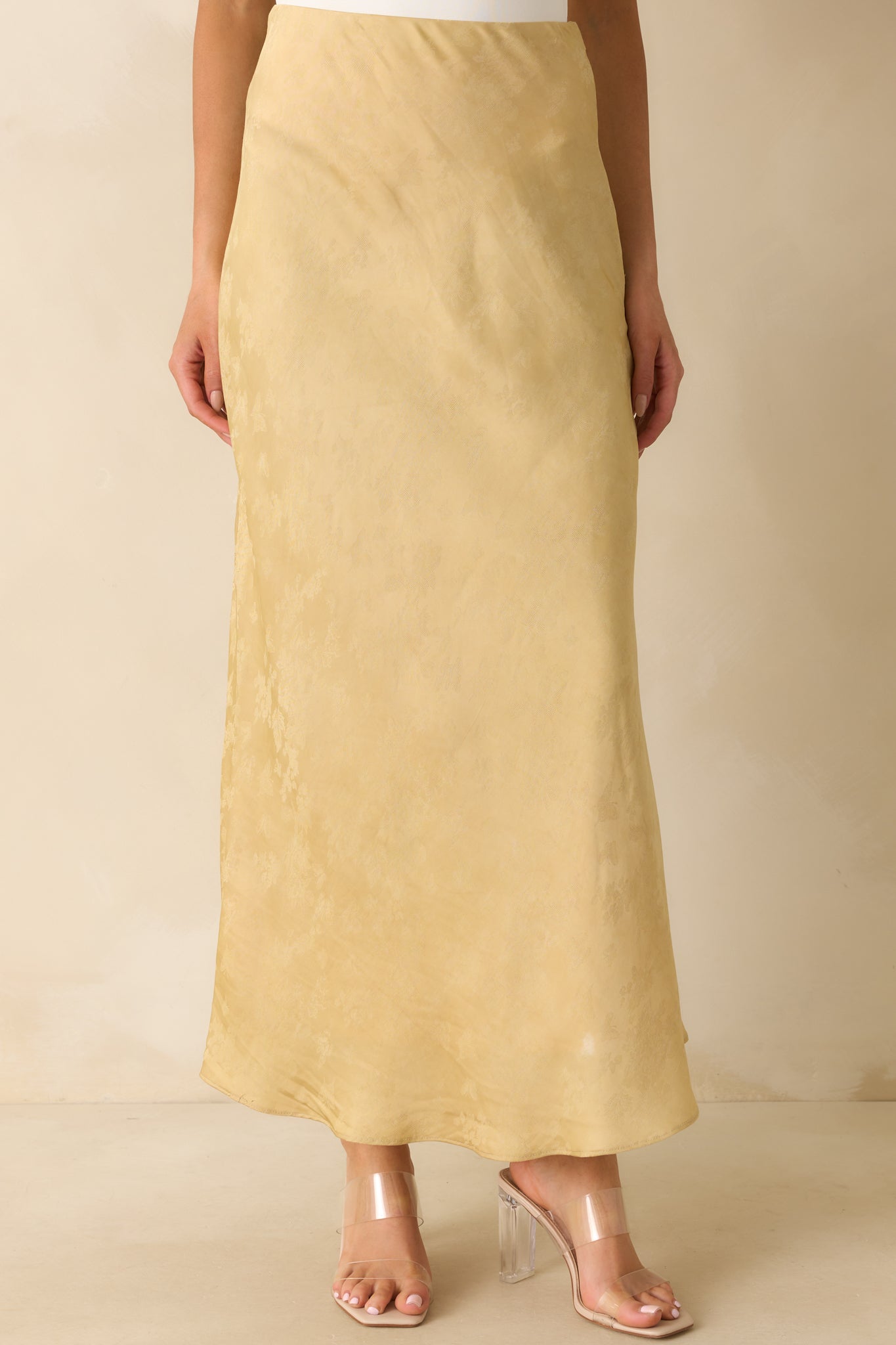 Front-focused angle highlighting the shimmer of the fabric and floral design.