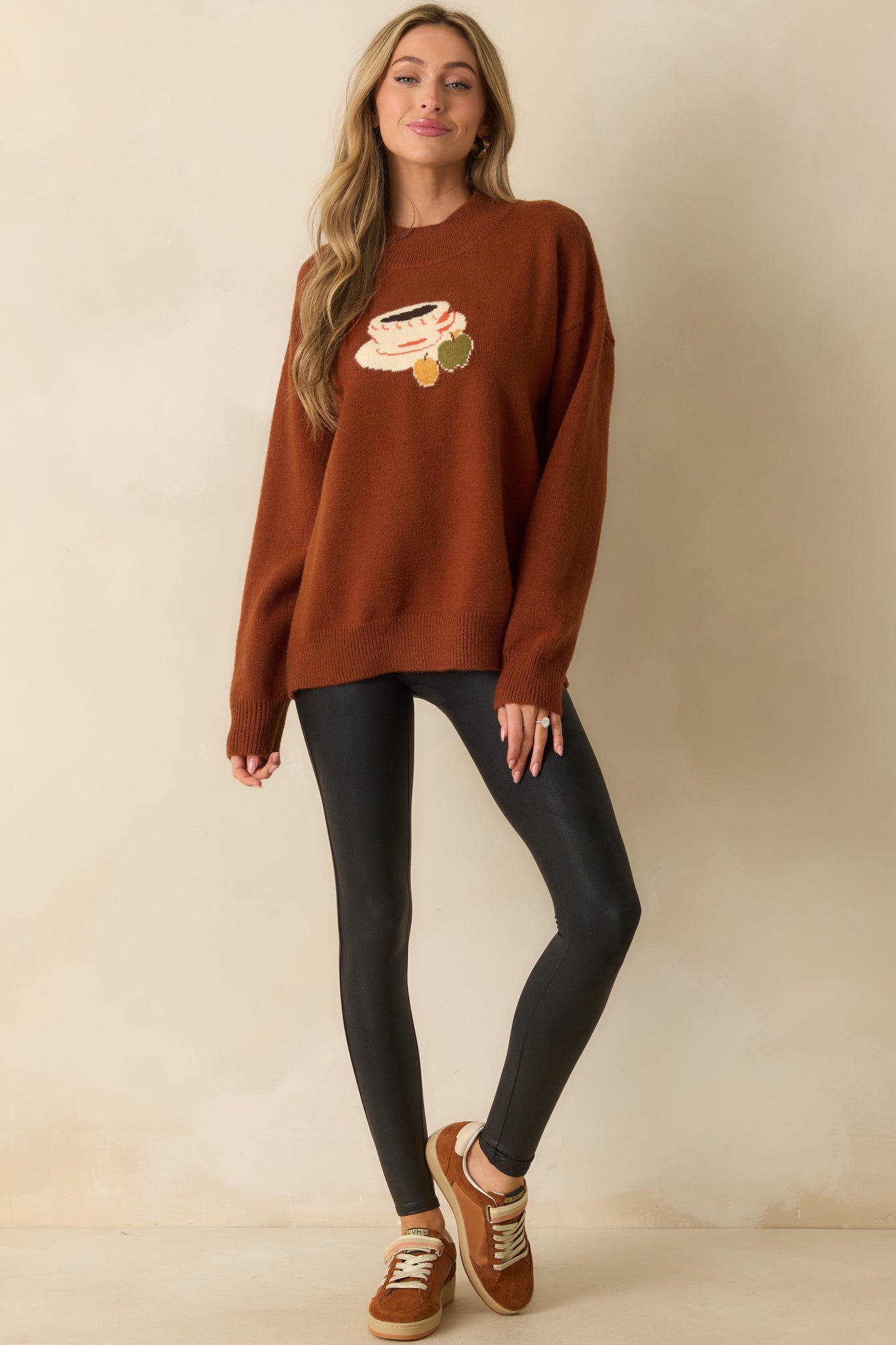 A front angle emphasizing the graphic design on the chest and cozy oversized silhouette.