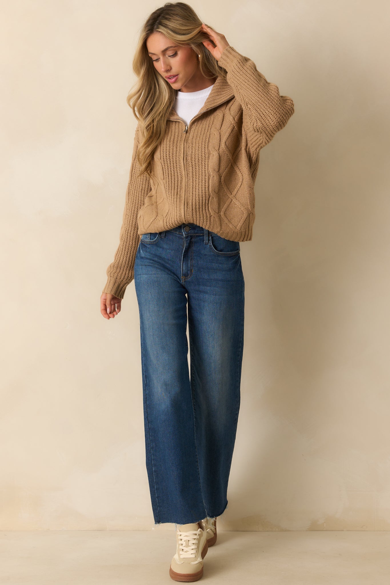 Another front angle highlighting the long sleeves and ribbed knit hems.