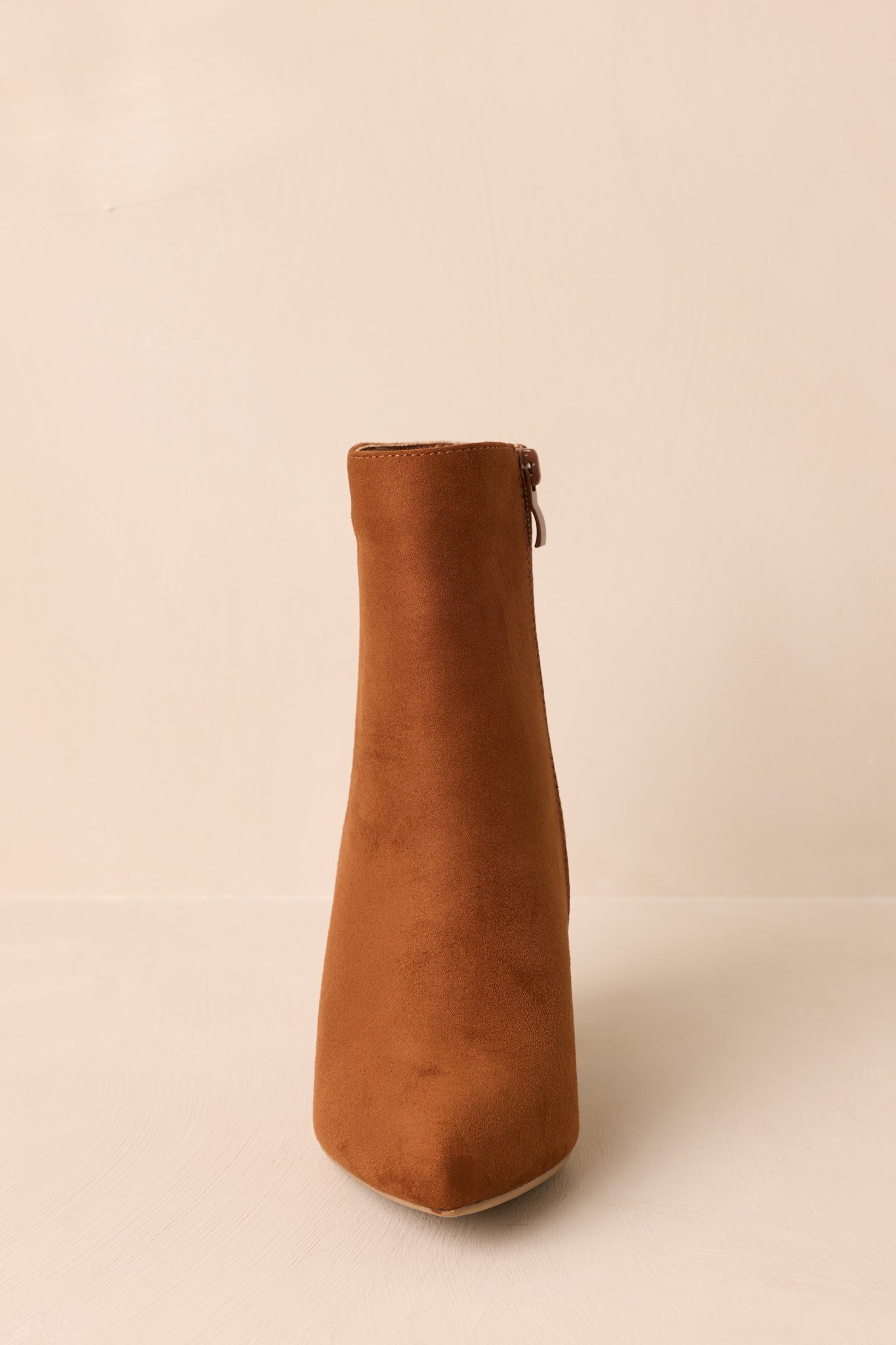 Front angle of the cinnamon brown ankle boots showcasing the pointed toe.