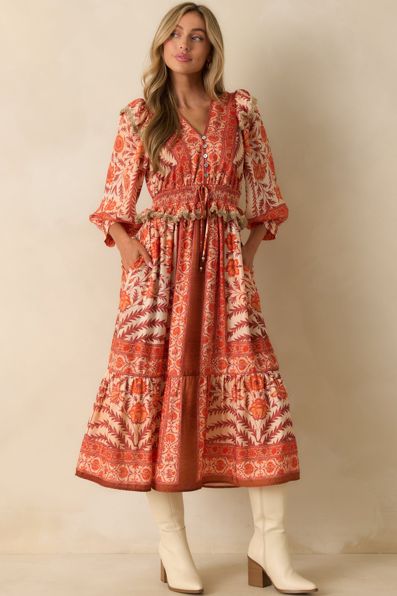 Full body front angle capturing the overall tiered flow and vibrant patchwork print of the dress.