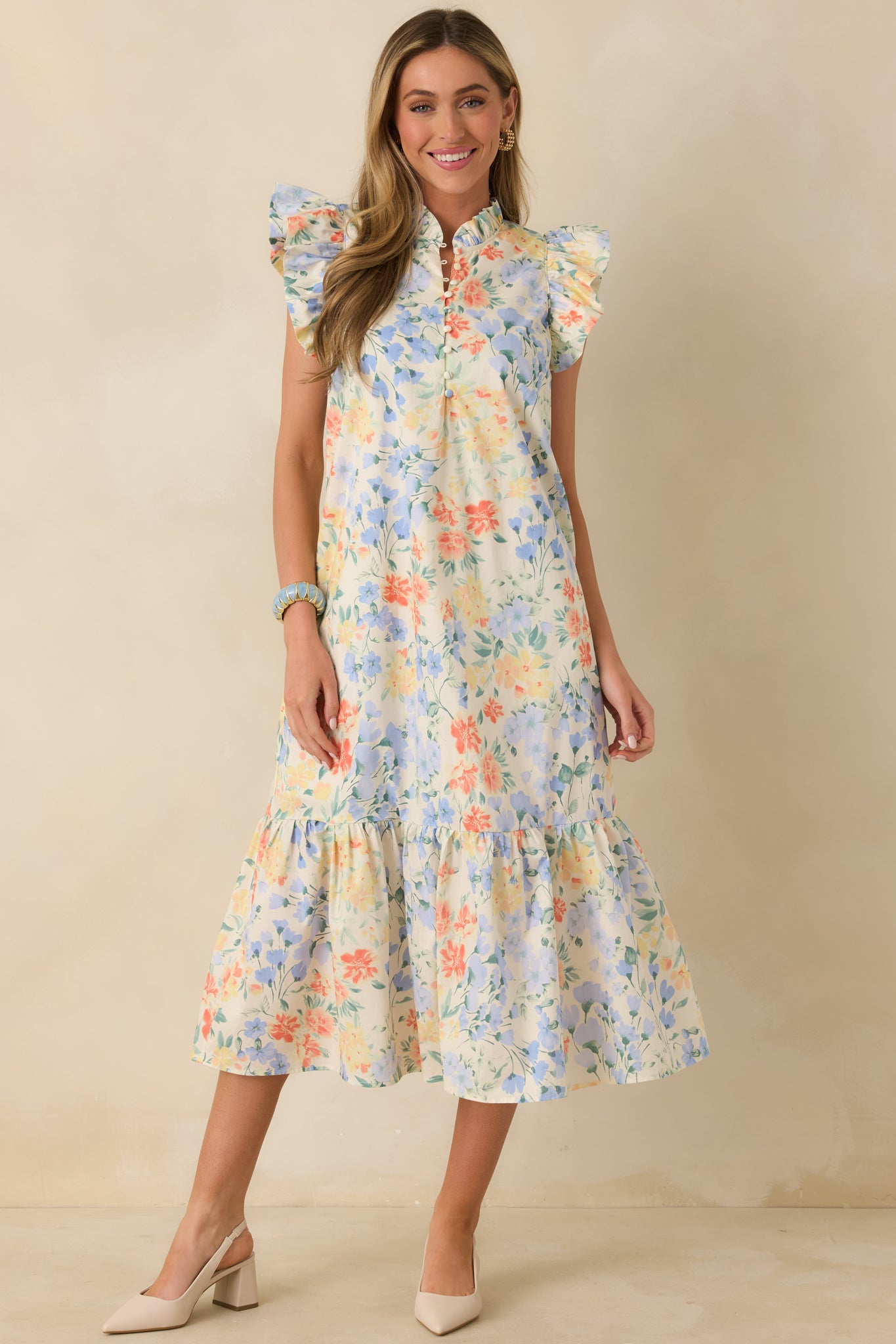 Straight-on front angle showing the split neckline, lightweight cotton fabric, and flutter sleeve detailing.