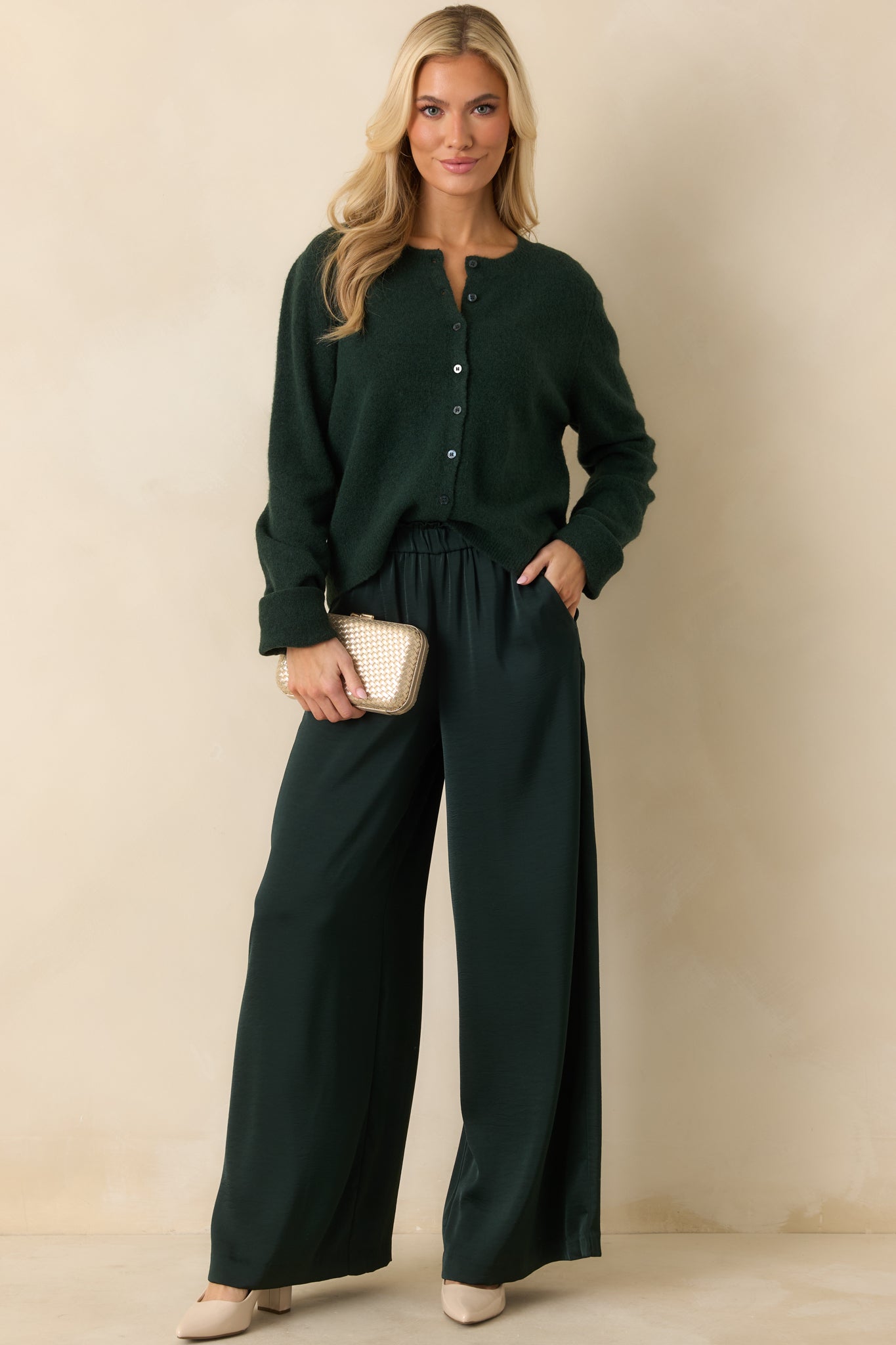 Front perspective showcasing the cardigan’s lightweight drape and classic crew neckline.