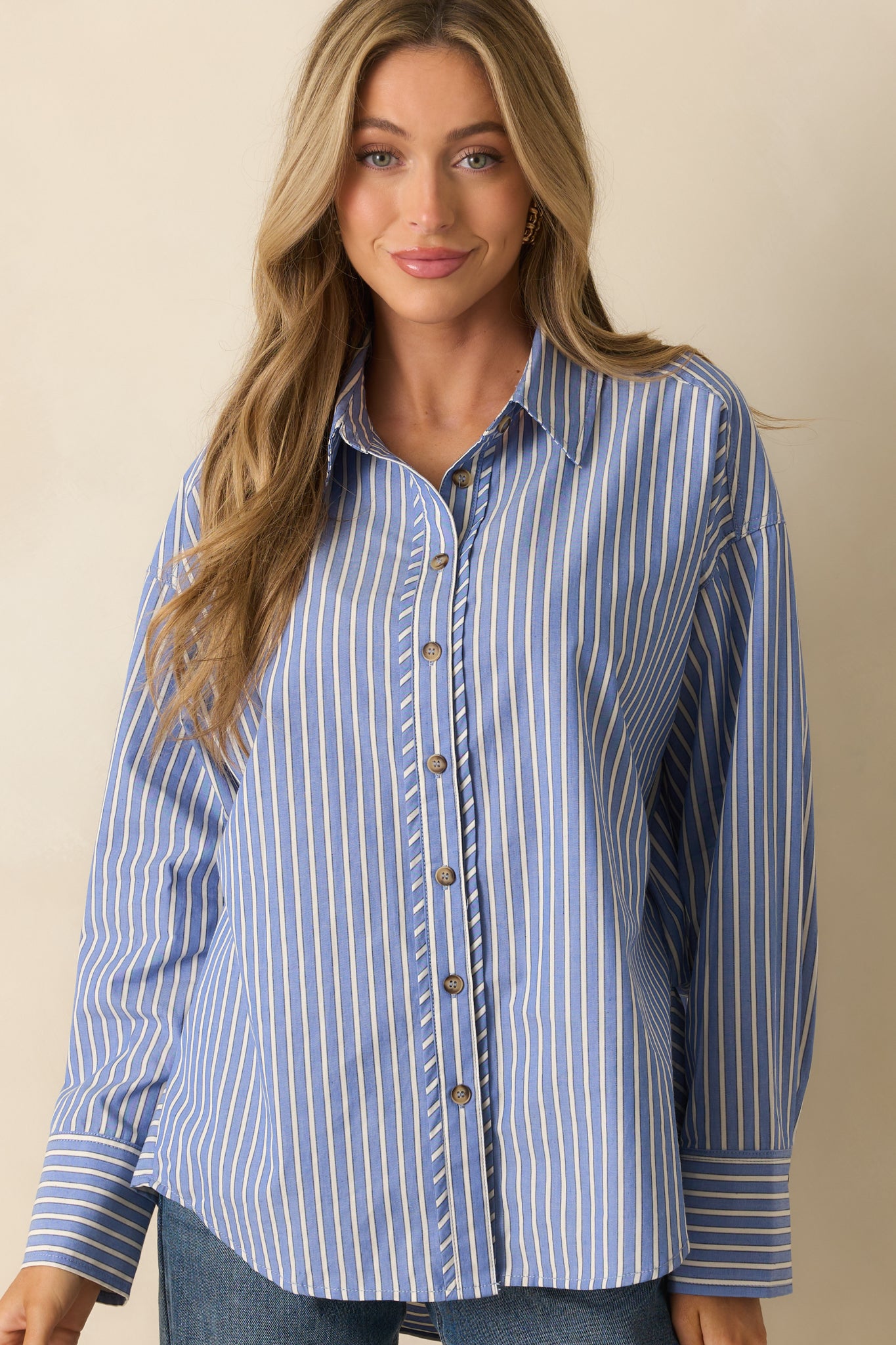 Front crop highlighting ivory stripe pattern and soft knit texture of the shirt.