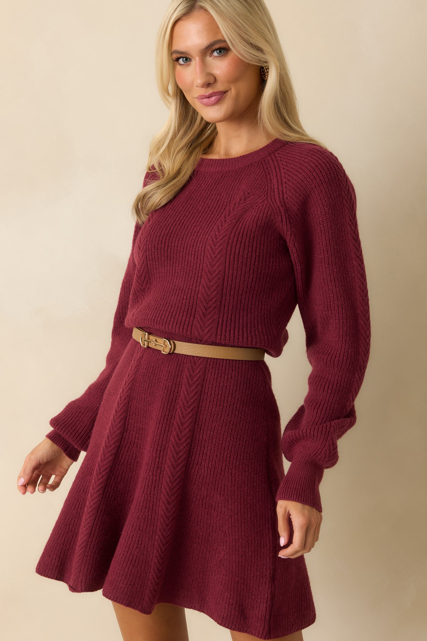 Front-focused detail showing the ribbed fabric and flared hemline.