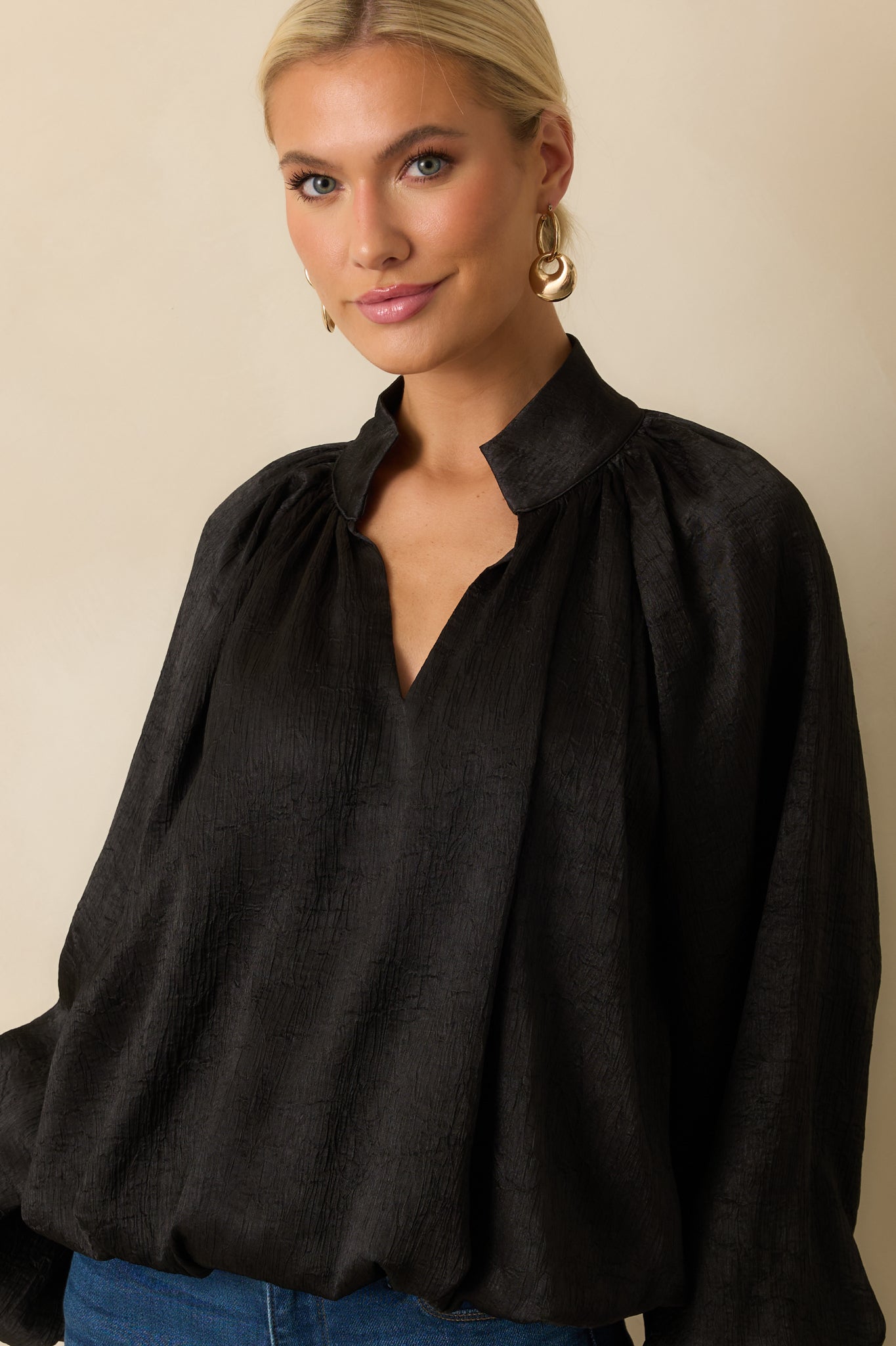Front-focused detail showing the relaxed silhouette and subtle textured fabric.