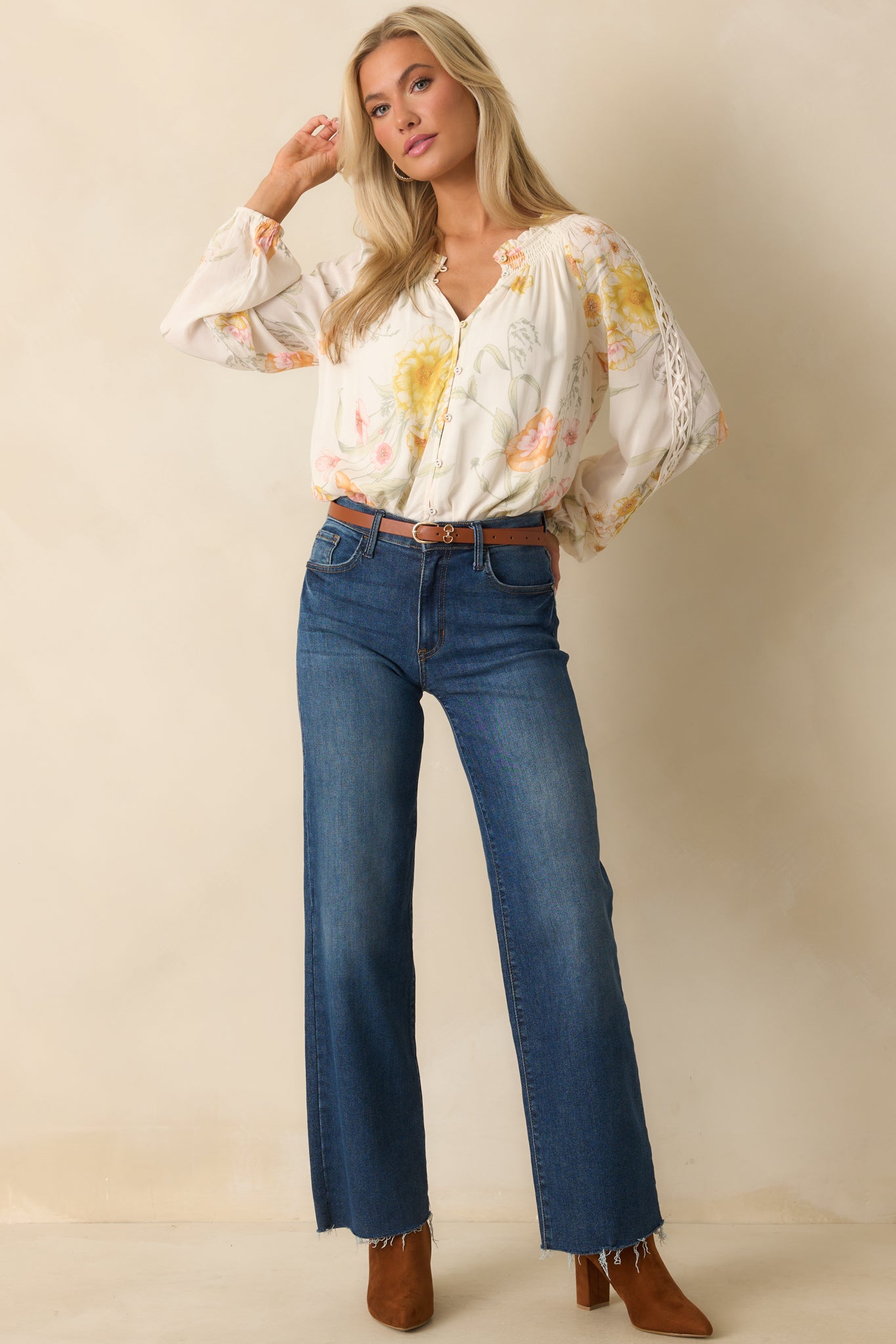 A front-facing image of the blouse highlighting the long sleeves and functional button front.