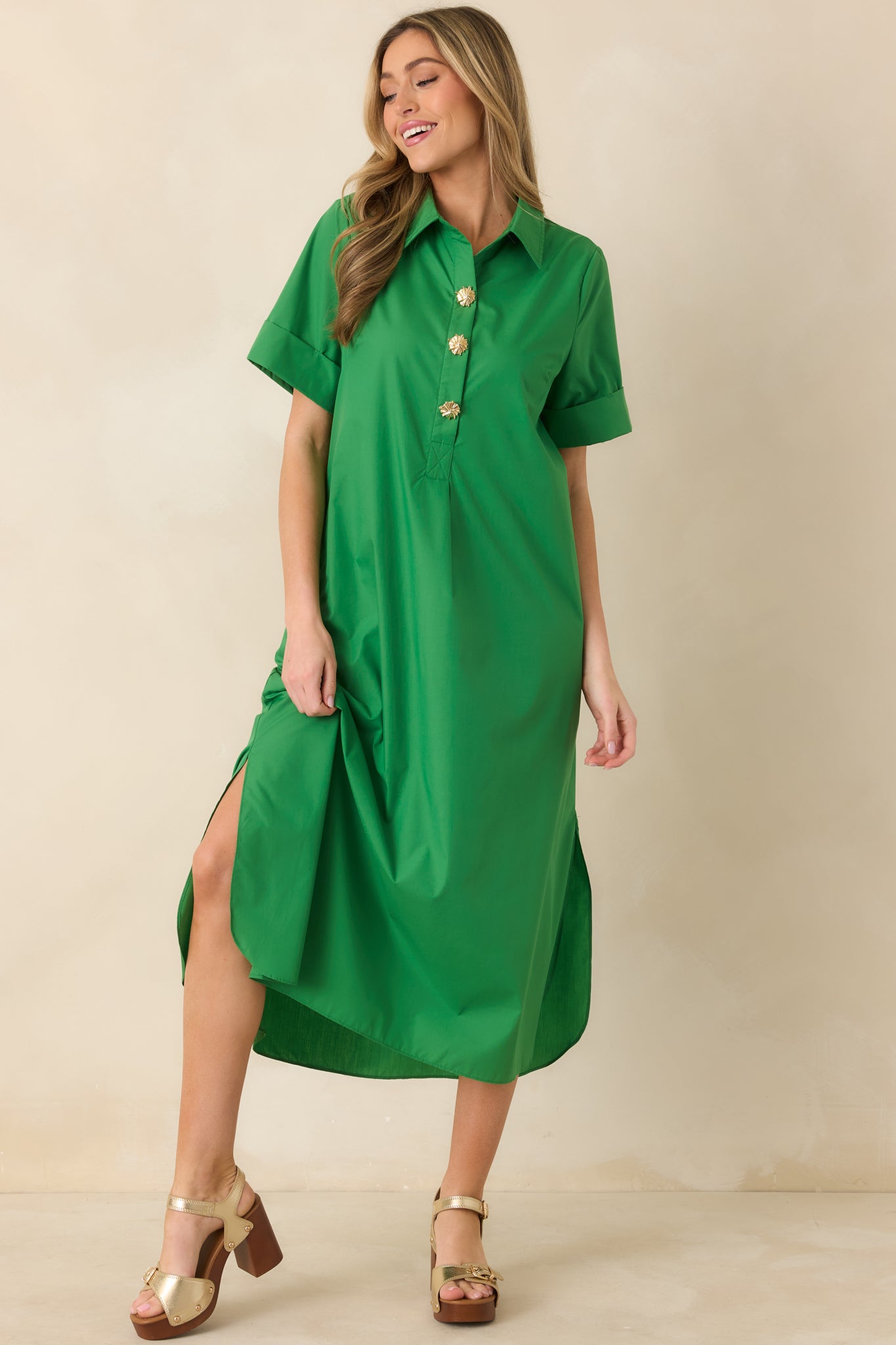 Front-facing image emphasizing the clean collar shape and elongated maxi length.