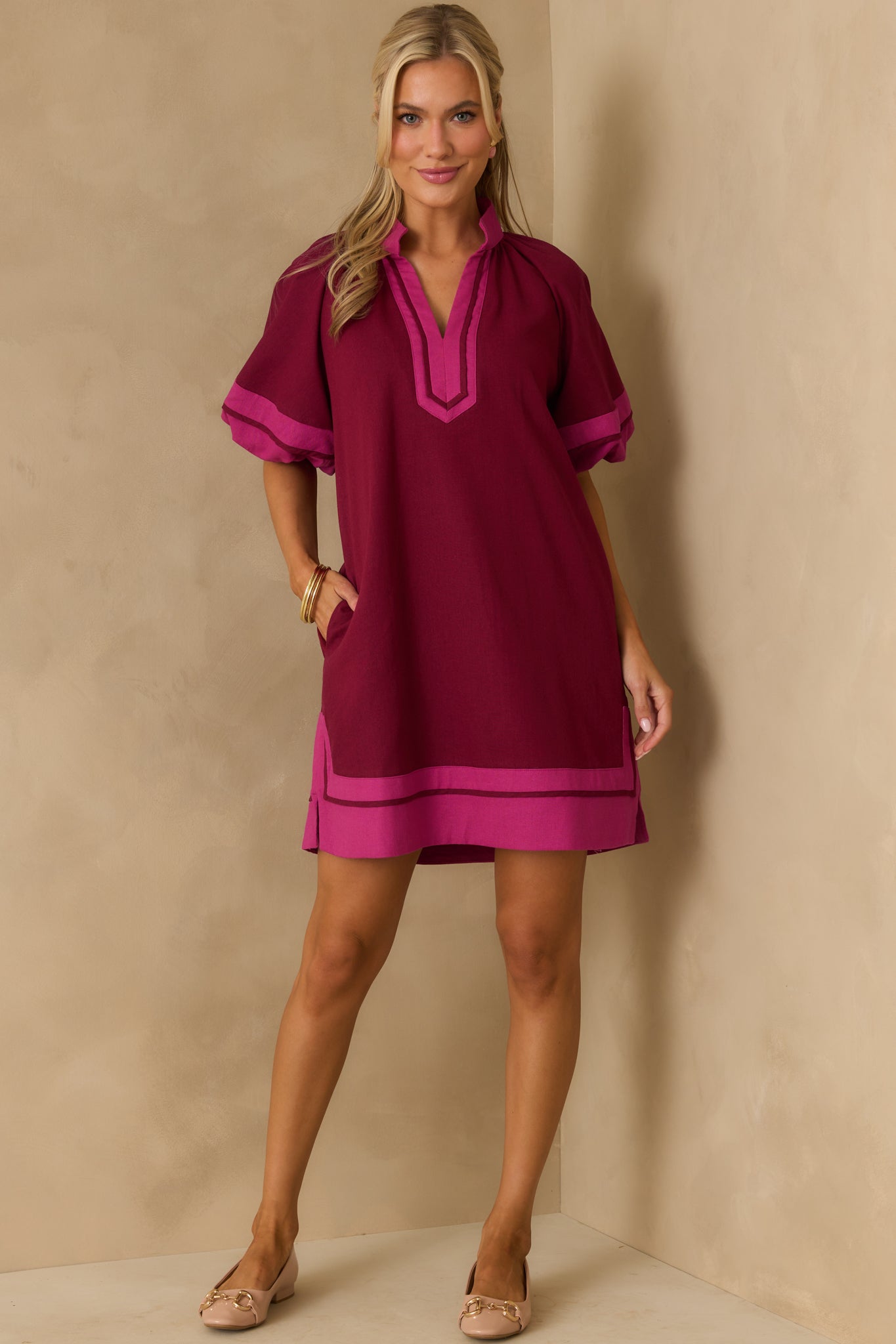 A front-facing image showing the shift silhouette, elastic cuffs, and pink contrast trim details.
