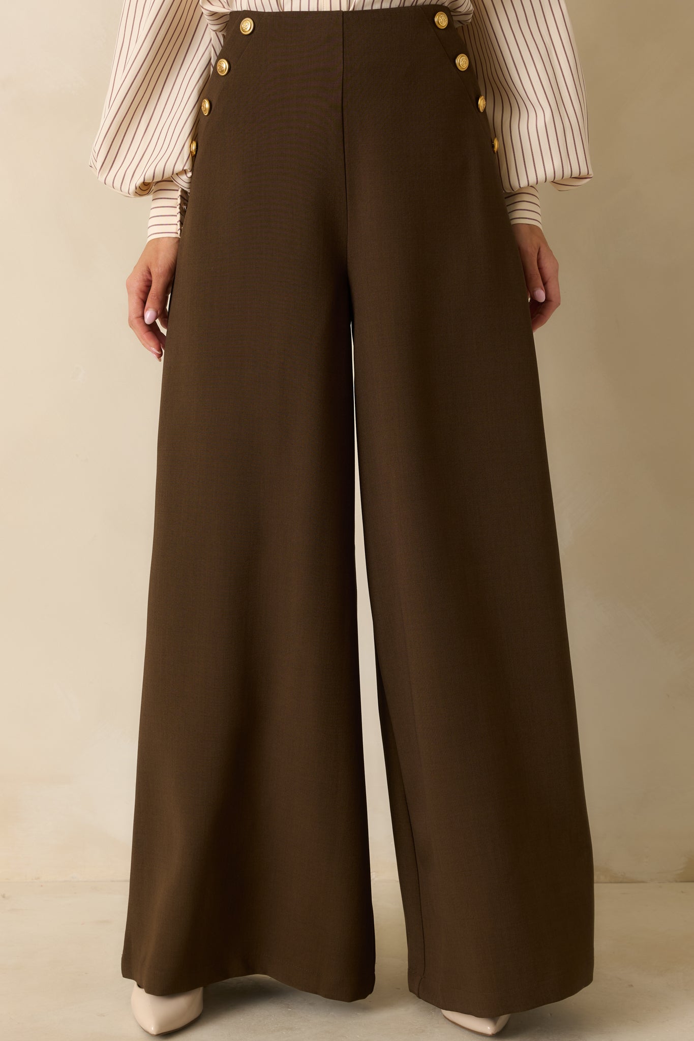 Front focus on the smooth woven fabric and tailored wide-leg lines.