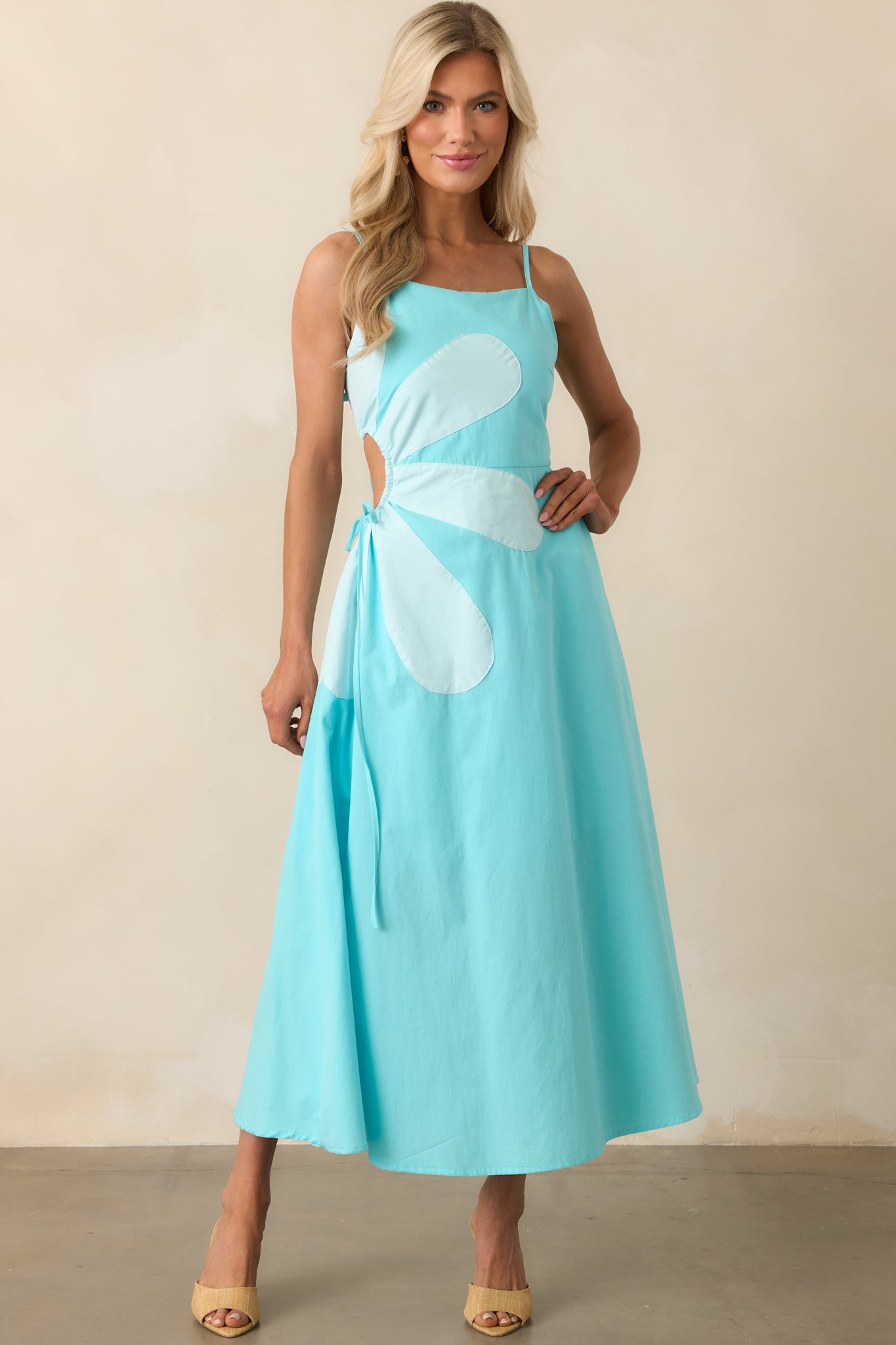 Full front image capturing the adjustable spaghetti straps and elegant length of the blue maxi dress.
