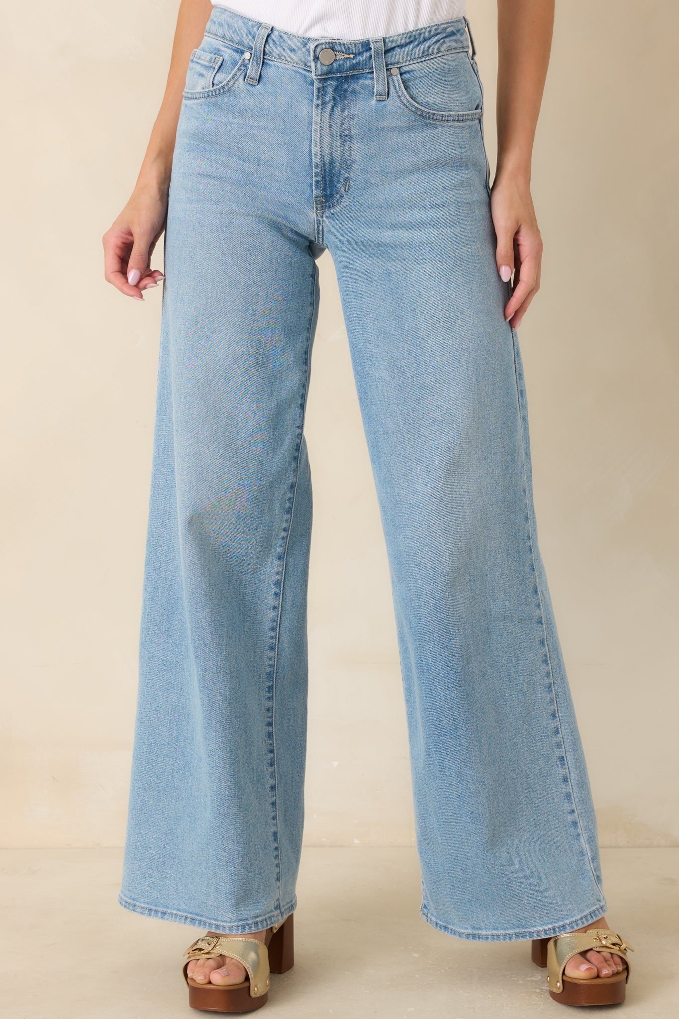 Front view of light wash wide leg jeans featuring an easy-fitting silhouette and versatile everyday design.