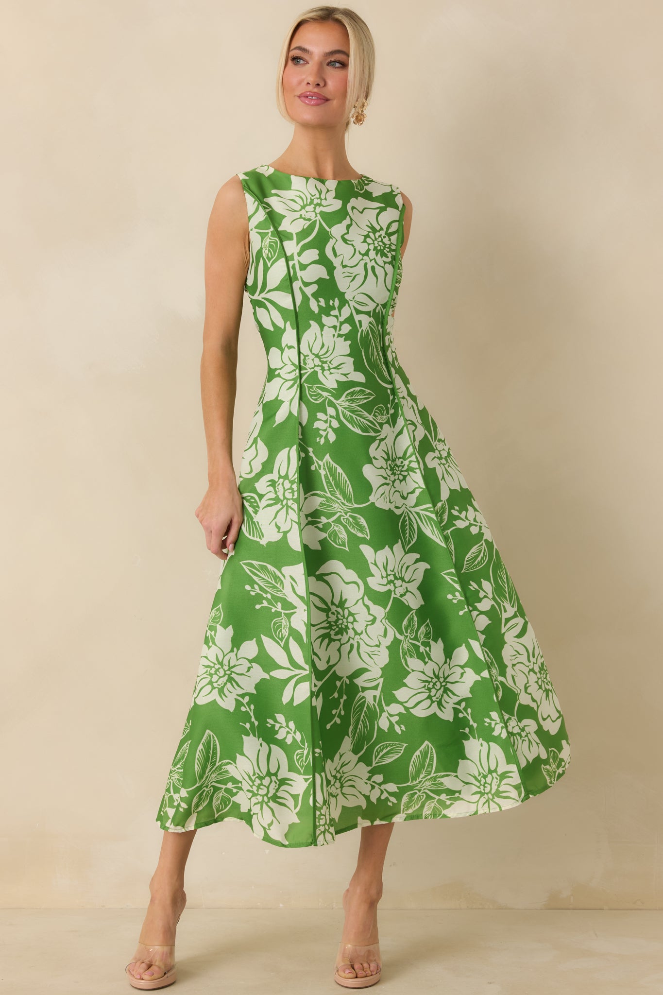 Angled front perspective highlighting the flattering fit, structured bodice, and floral pattern throughout the dress.