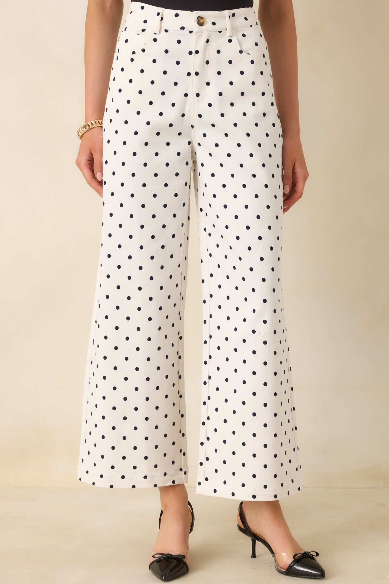 Front pocket area detail with vintage-inspired polka dot pattern and tailored stitching.