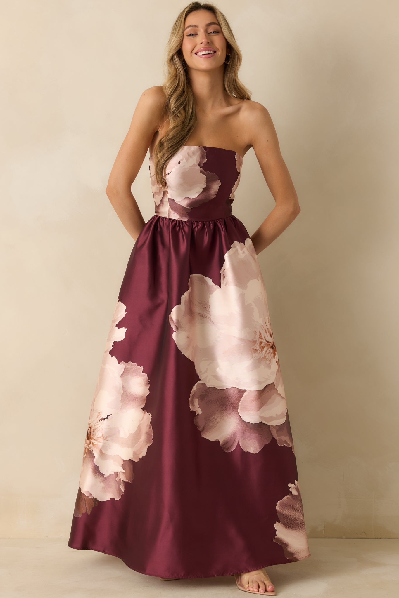 Front view capturing the dress’s structured bodice, smocked back fit, and subtle sheen of the floral satin.