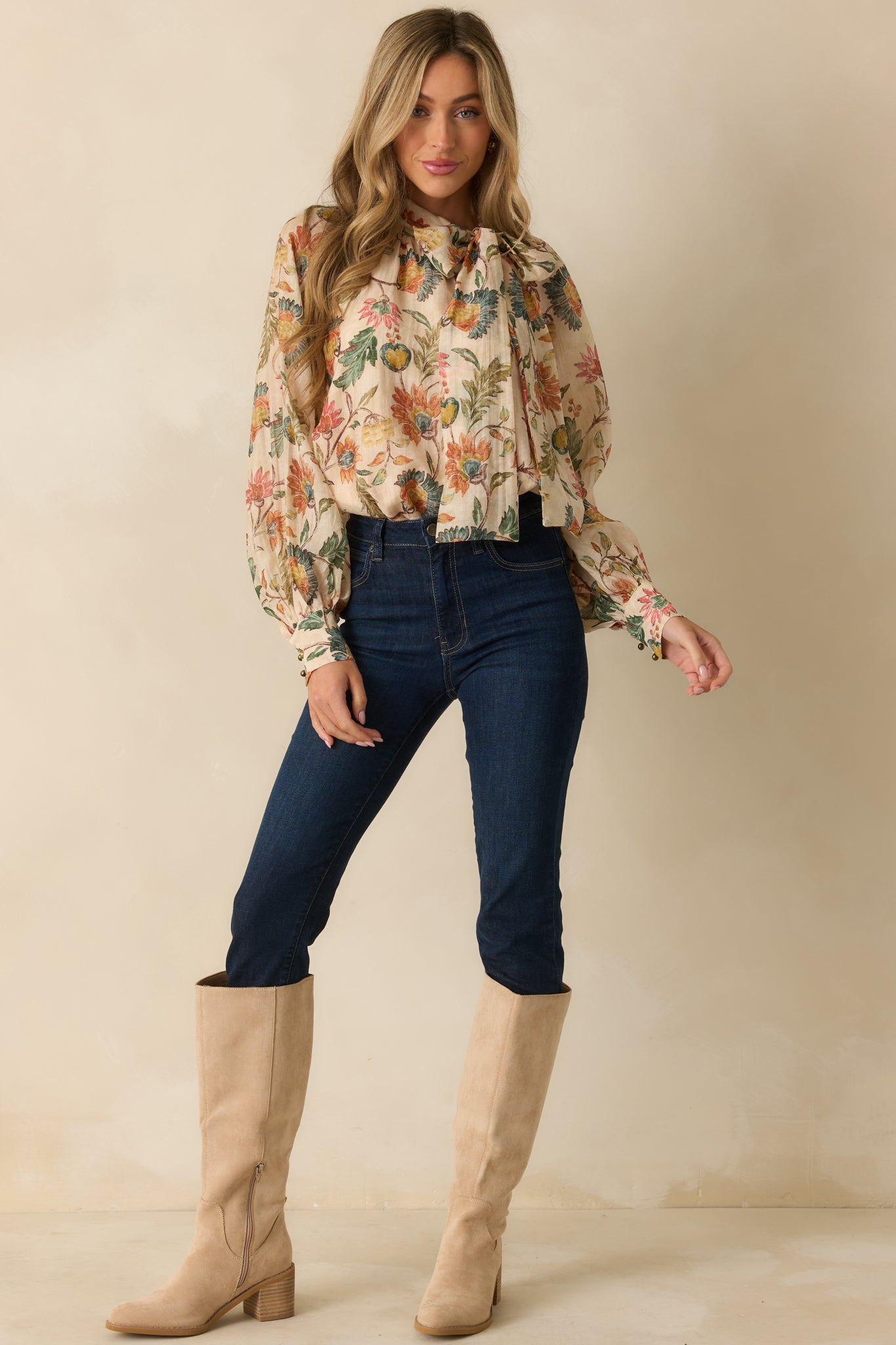 Floral beige blouse displayed straight on, emphasizing the balloon sleeves and loose, comfortable fit.
