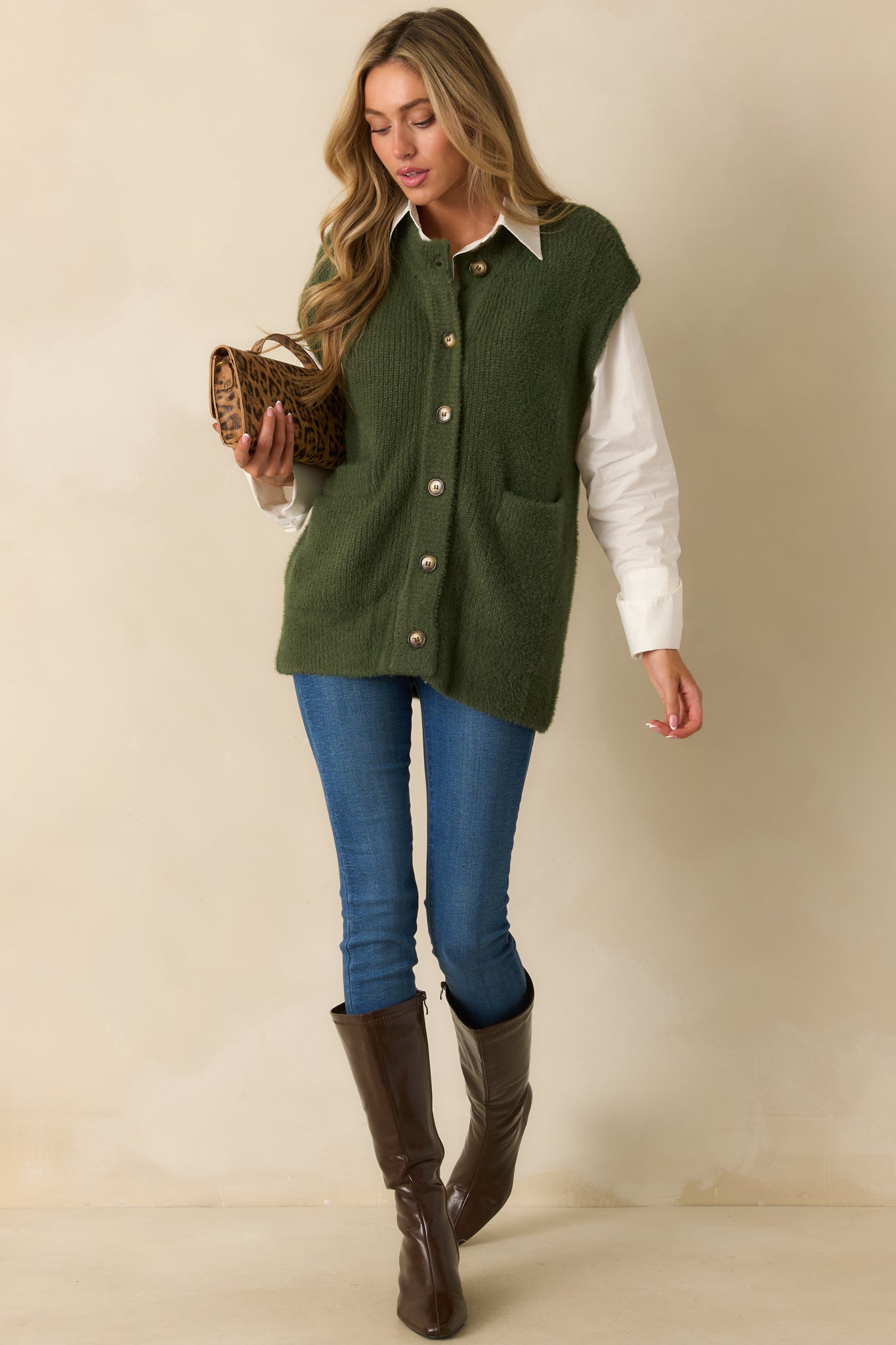 Front view of the cardigan highlighting the two patch pockets and soft drape.