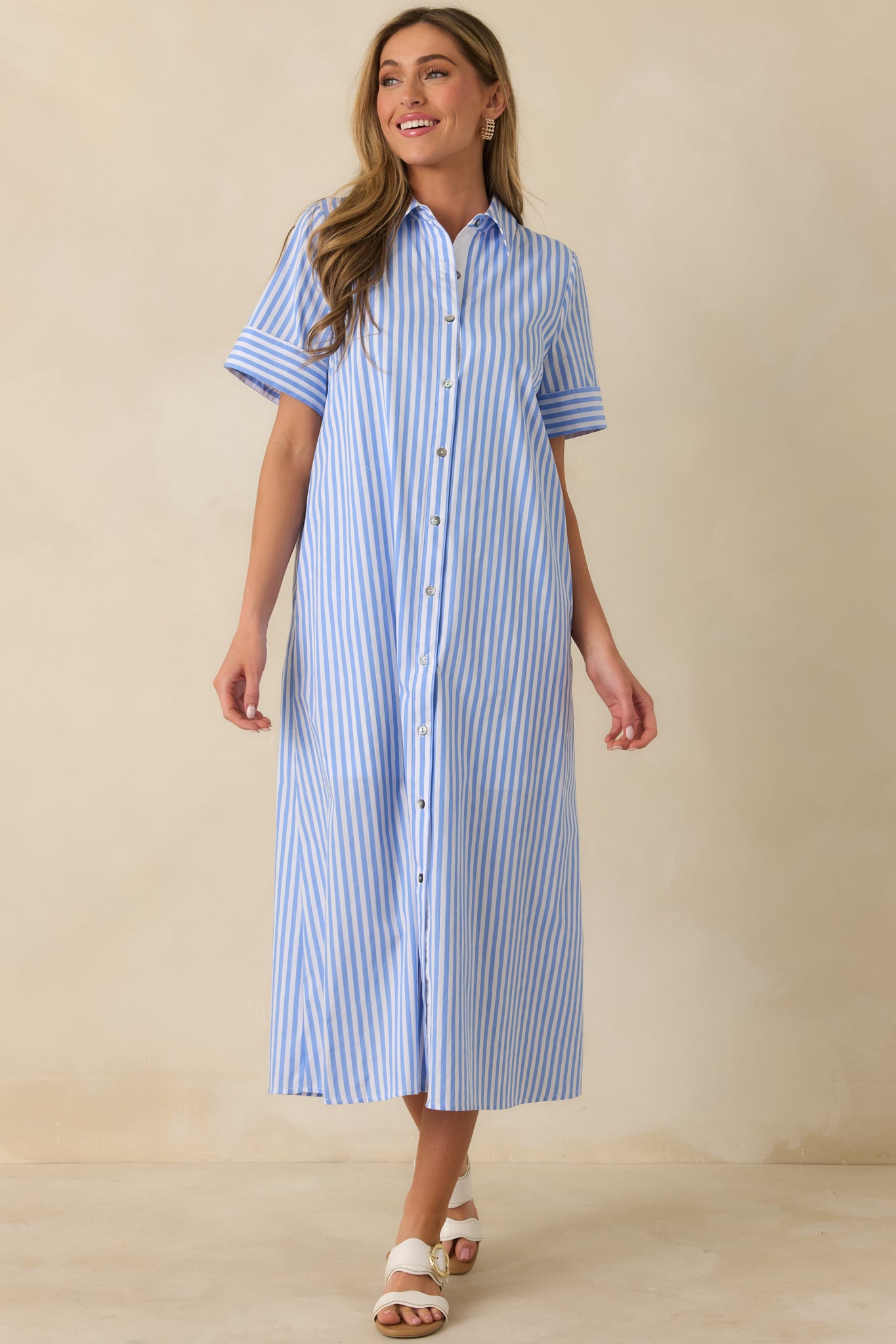 Front-facing view emphasizing the easy, relaxed fit and smooth drape of the blue and white striped dress.