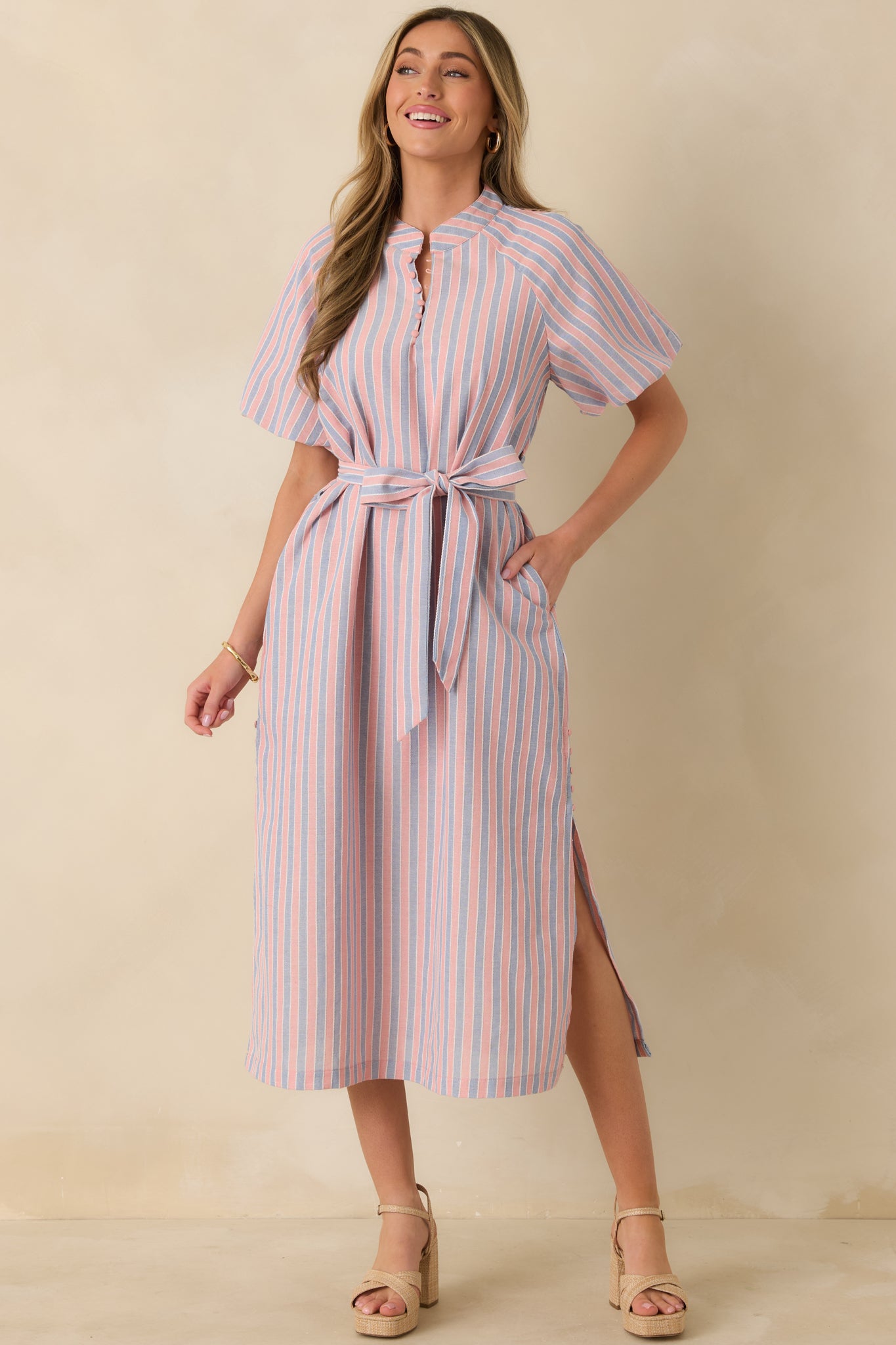 Front-facing view emphasizing the short sleeves, polished finish, and vertical stripe pattern throughout the midi dress.