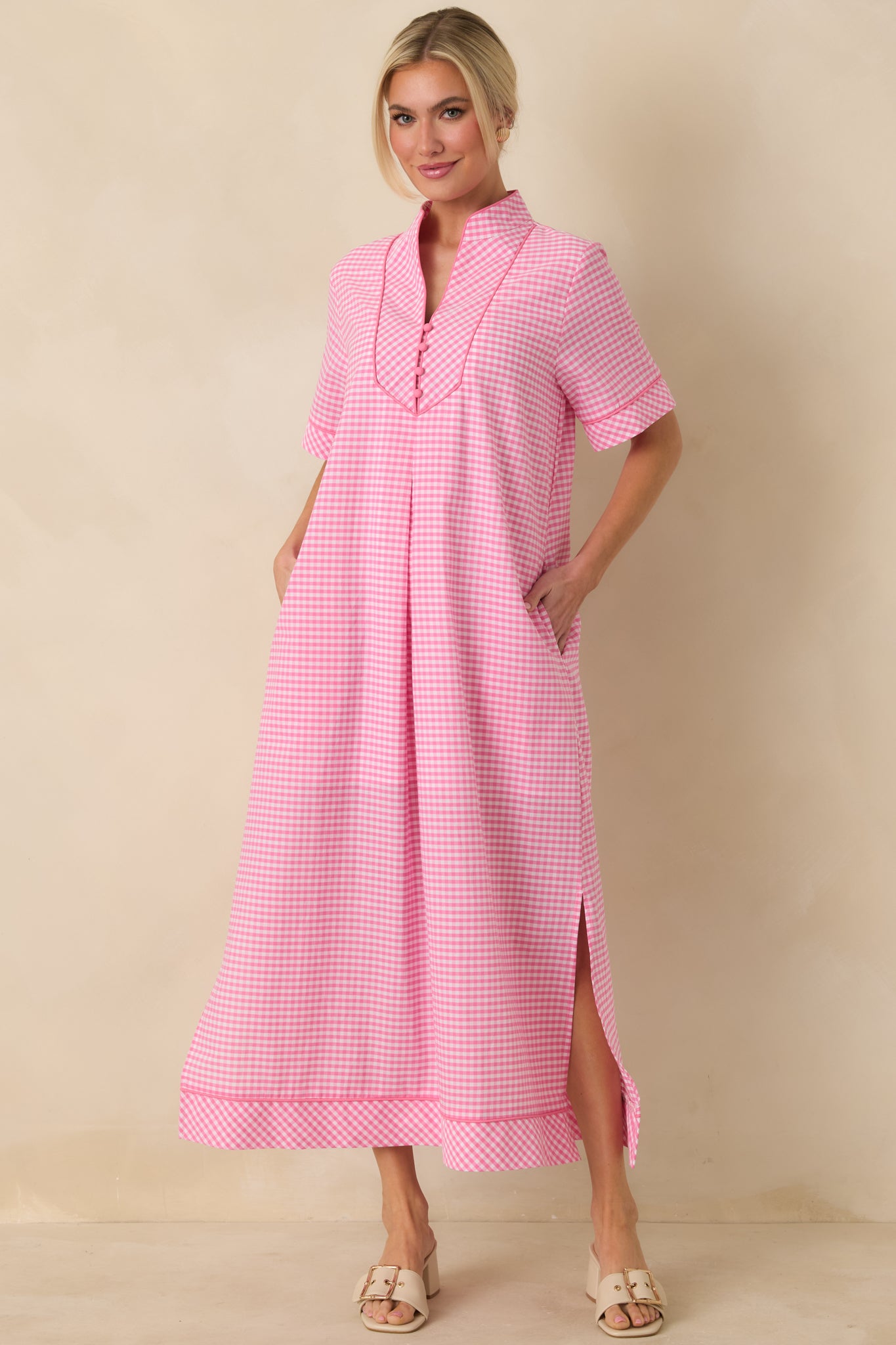 Front view of a pink gingham maxi dress emphasizing the soft structure and easy flowing maxi length.