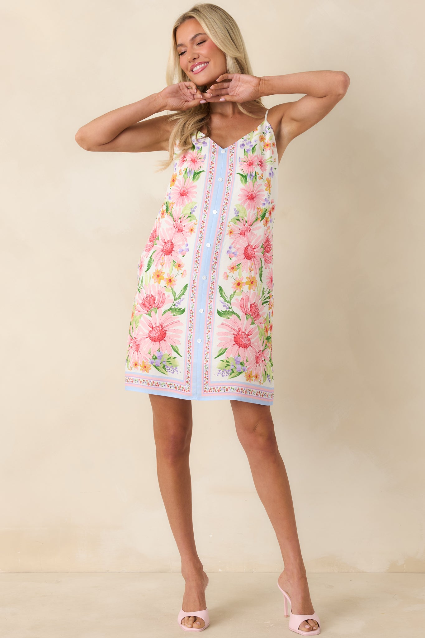 Full front view emphasizing the V-neckline, button-front design, and easy, casual fit of the dress.