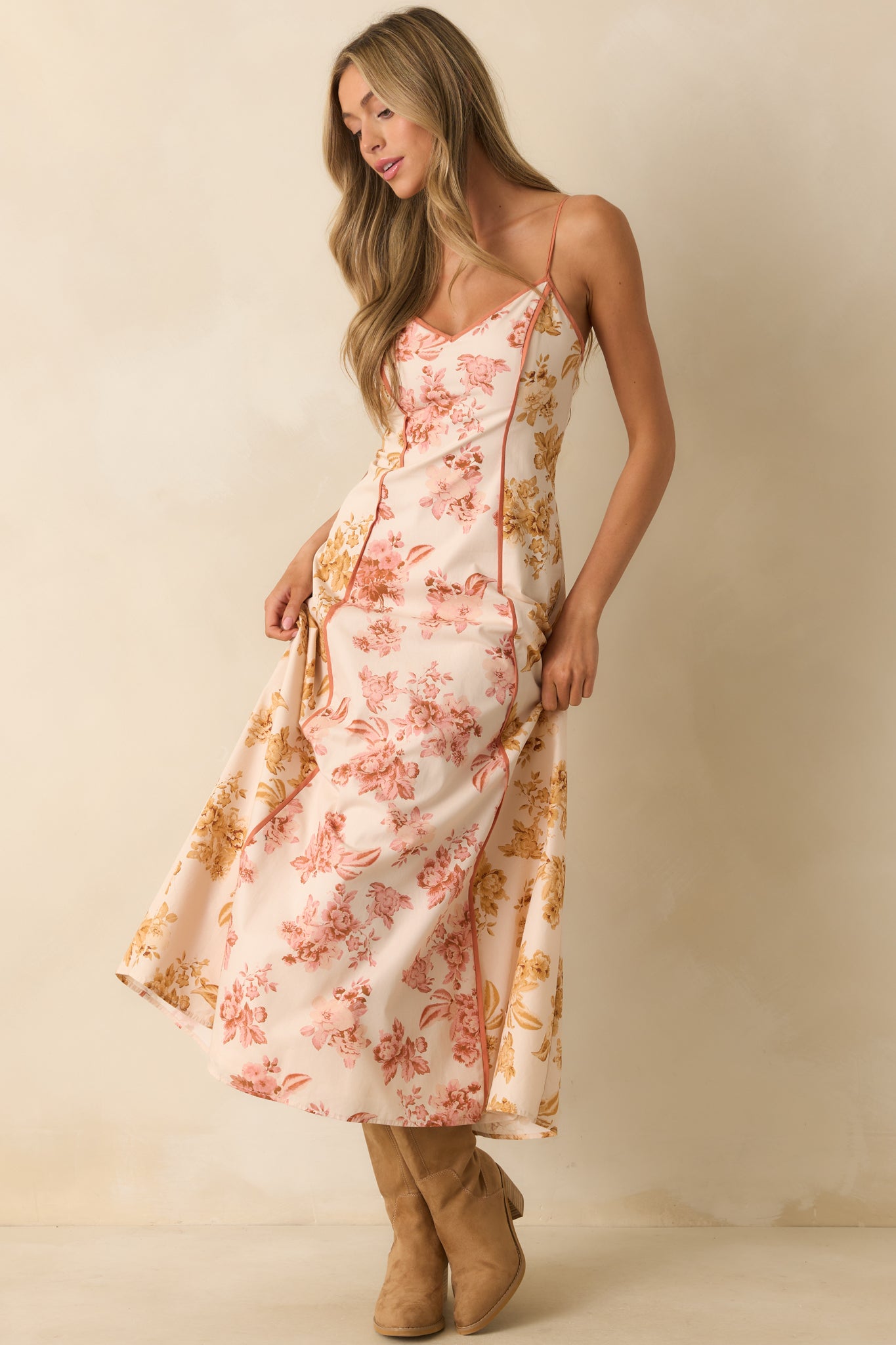 A front-facing view of the floral maxi dress showcasing the fitted bodice and flared hem.
