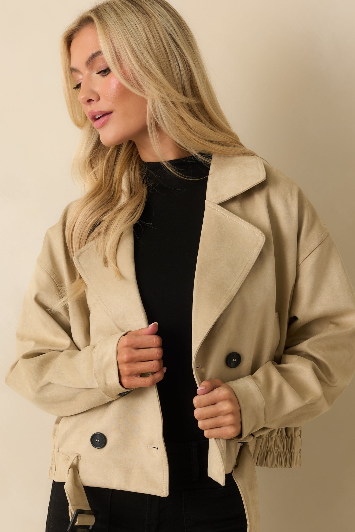 Front view focusing on the four-button double-breasted closure and notched lapels.
