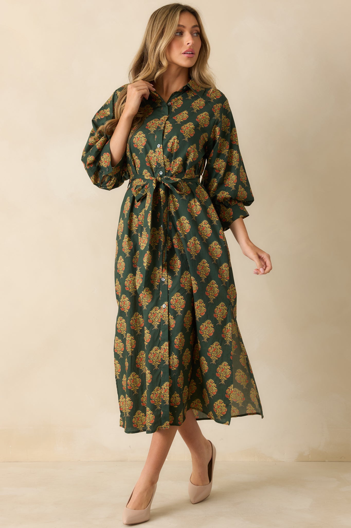 Green floral block print maxi dress displayed front-facing, showing the full length, collared neckline, and waist tie.