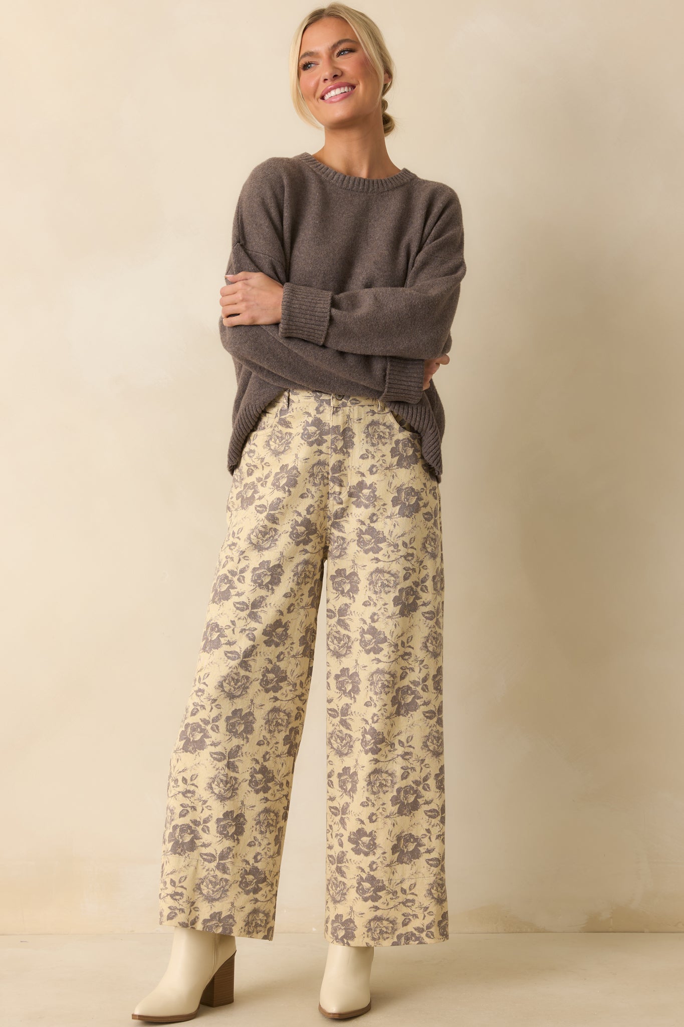 High-rise grey pants displayed fully front-facing, emphasizing the soft fabric and polished design.