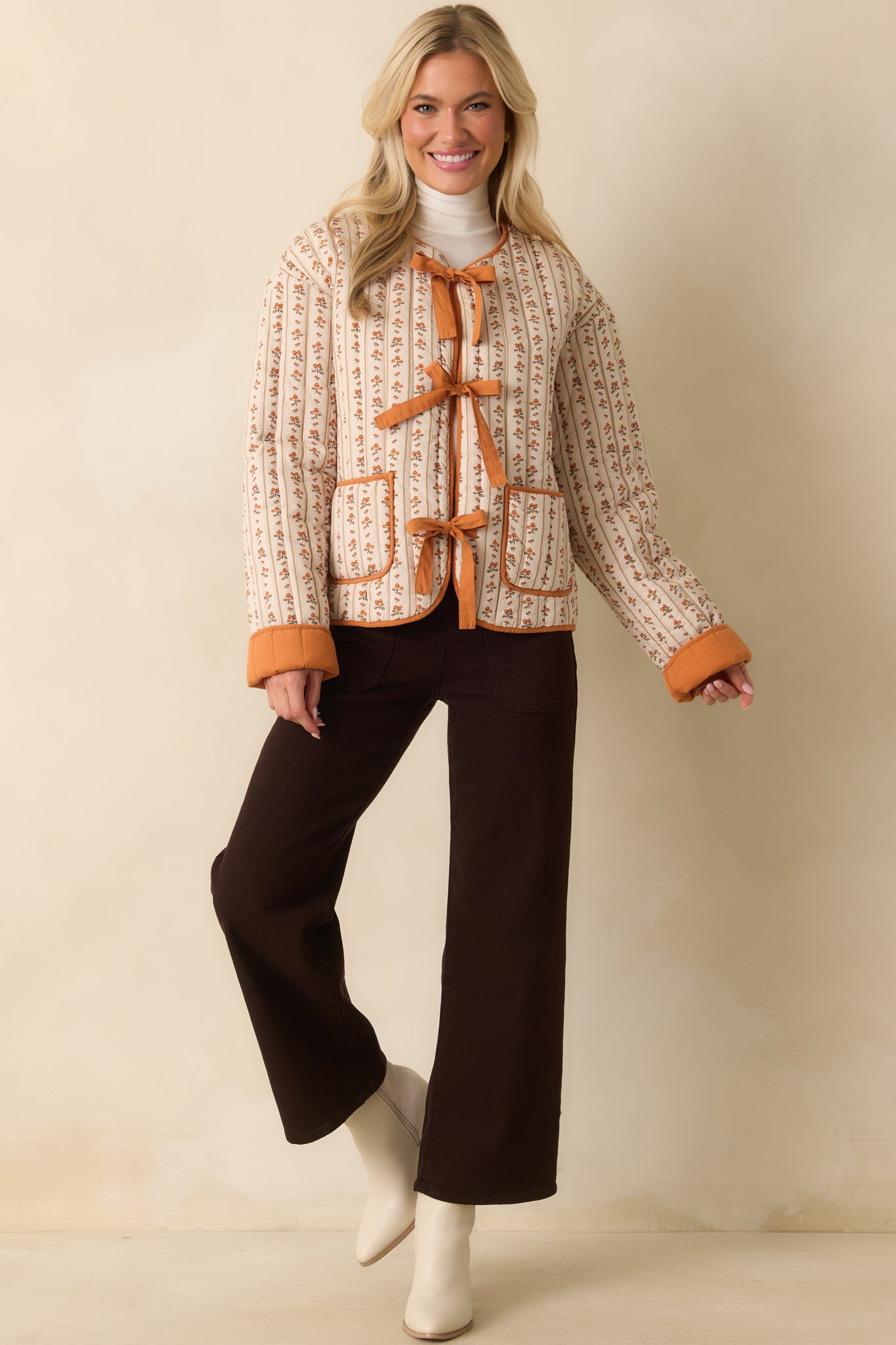 A front-facing full view featuring the structured high rise and functional belt loops.