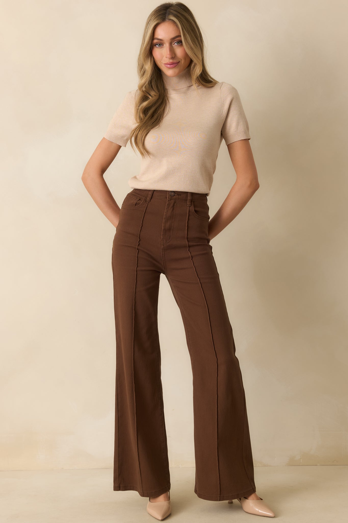 A straight-on front view emphasizing the high-rise fit and relaxed wide-leg drape.